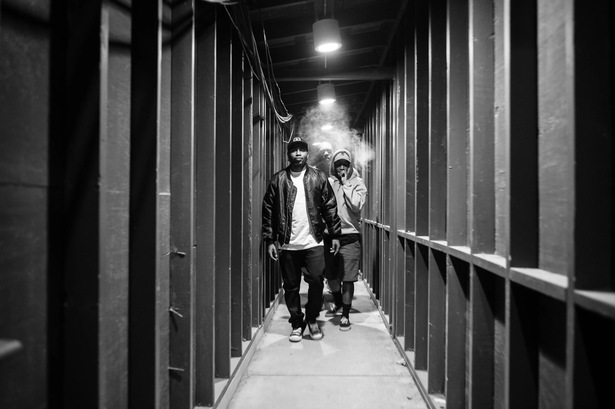 Moskie and Dizzy smoking a blunt, walking to stage