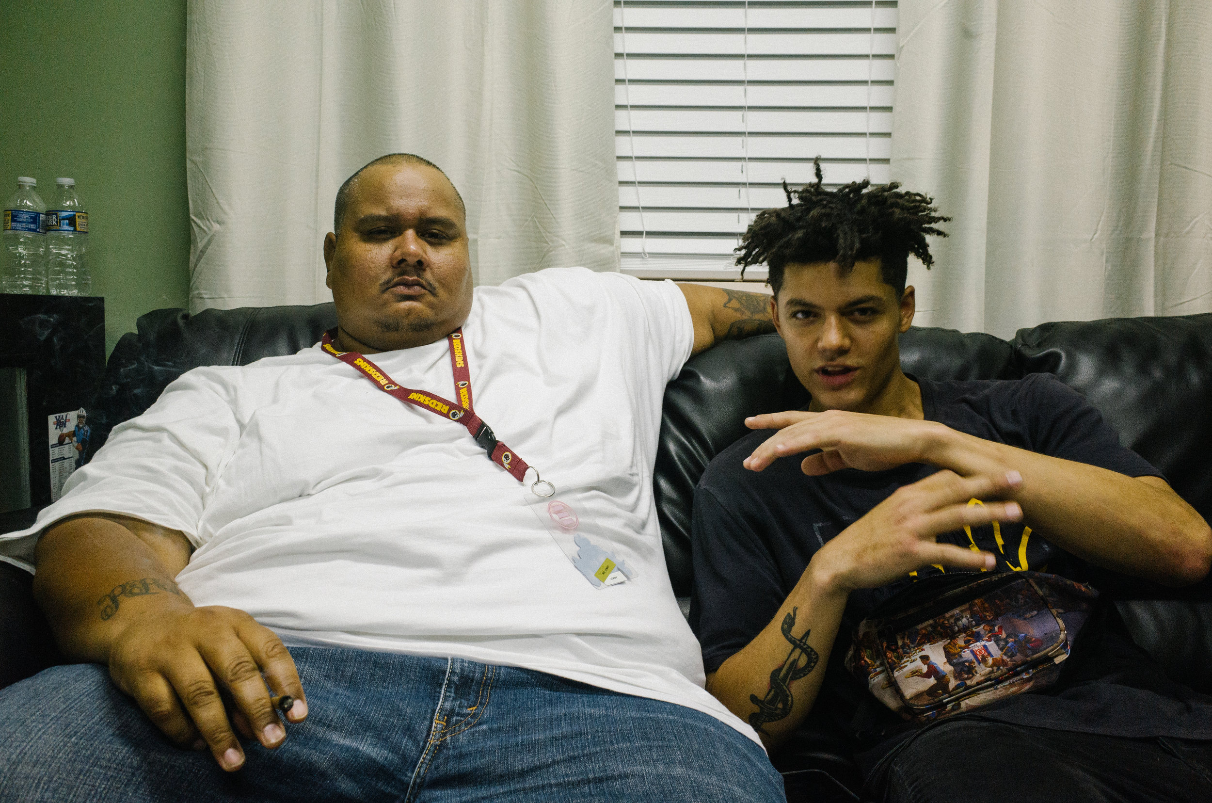 Lenbo and Alex, his DJ, smoke a joint after a show in Raleigh, NC