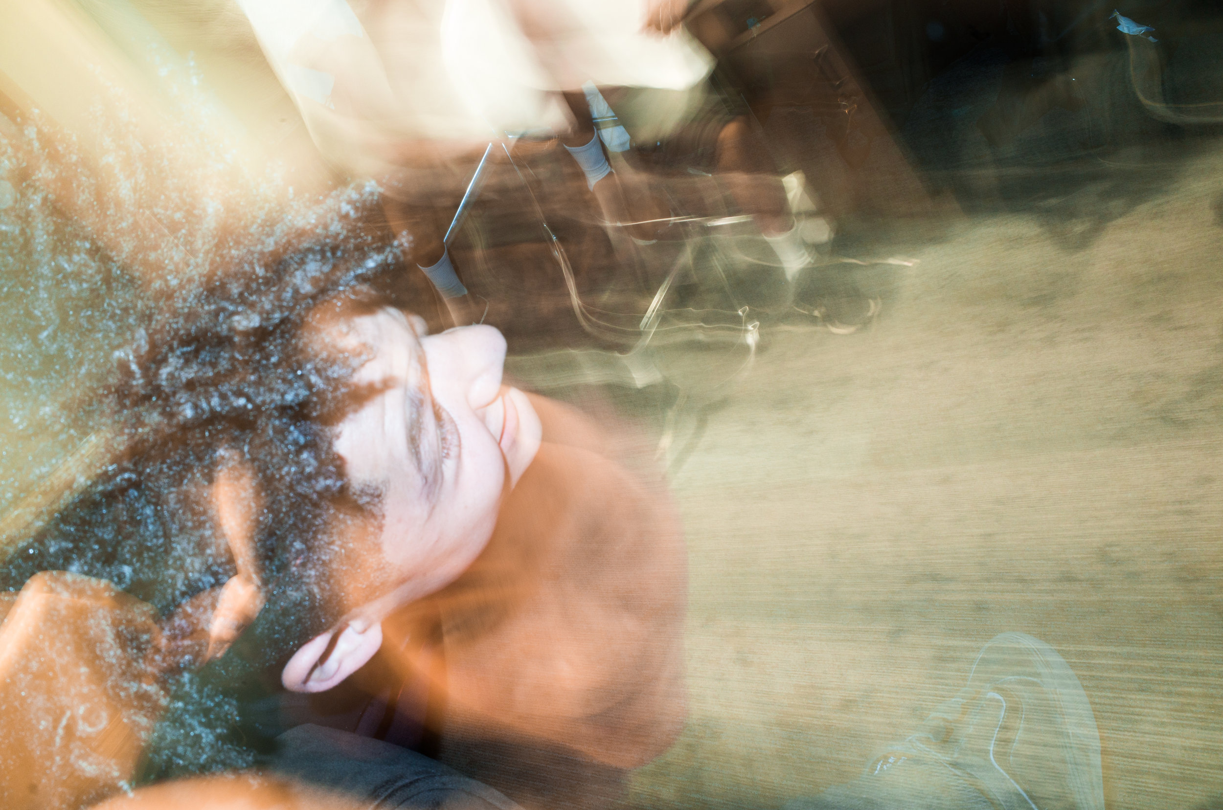 5 second exposure of Alex falling down after attempting to do a kick flip off the couch