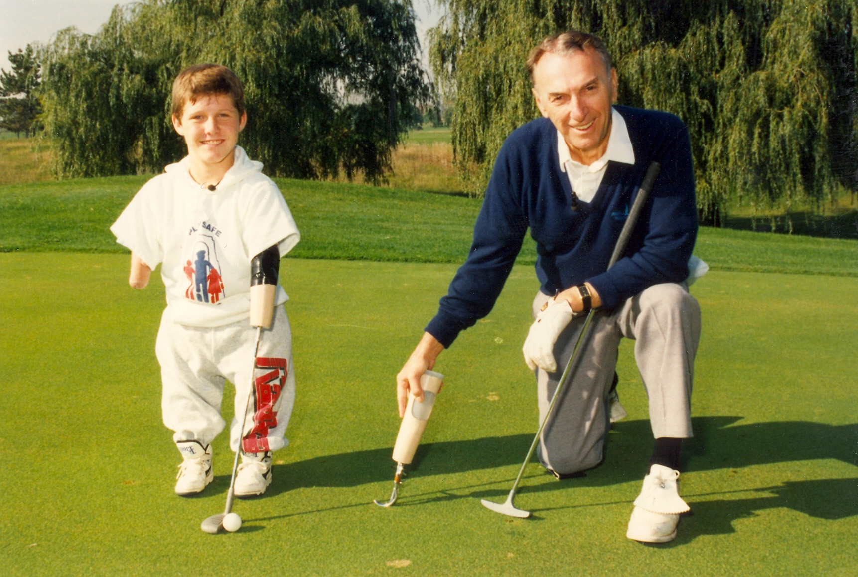 cliff and chris k on the green posing with putters.jpg