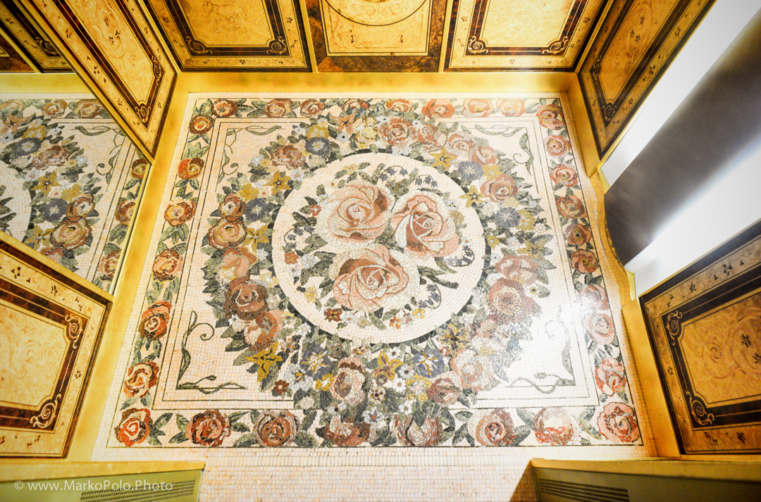 Spanish mozaics floor in the elevator. Sides of Karelian birch