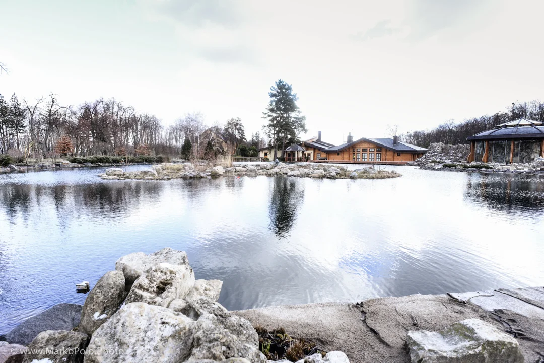 Two man made lakes side by side with fake waterfalls and pumps circulating water back up. The buildings in the background are saunas, glass one with traditional wood heated jacuzzi, finish dry sauna, and a Russian bania, dipping pools etc