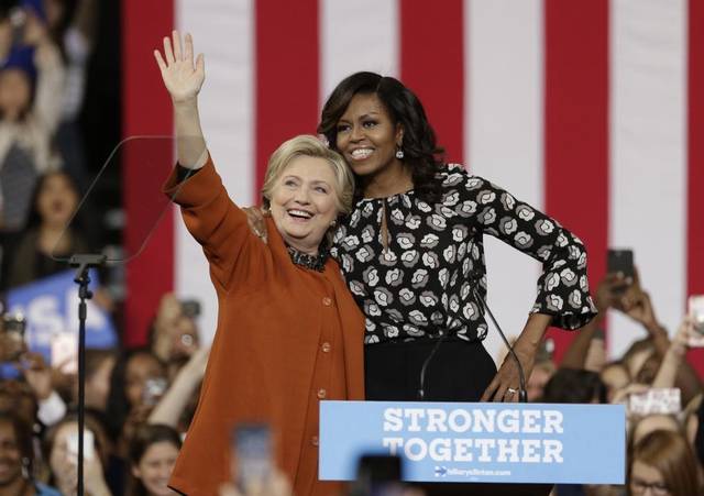 Hillary Clinton and Michelle Obama /photo via AP