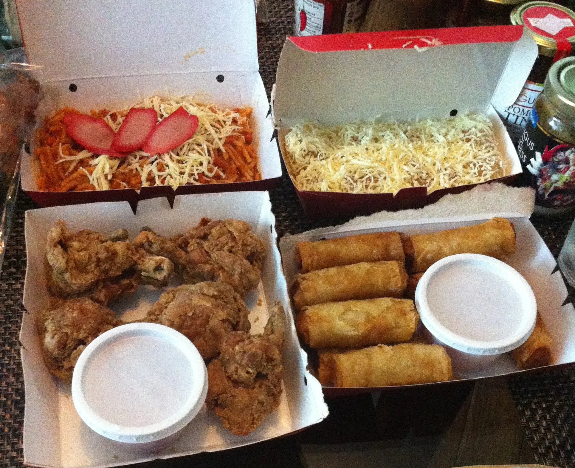 Popular fast food: Filipino spaghetti, fried chicken, lumpia&nbsp;(summer rolls), and pichi pichi -- a steamed cassava dessert, this time covered in cheese.&nbsp;