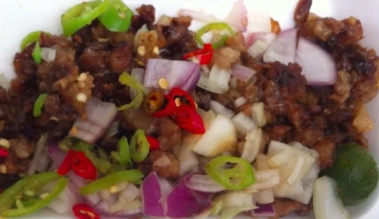 My favorite Filipino food? Sisig -- pig face salad -- here bought on the street in Manila.&nbsp;