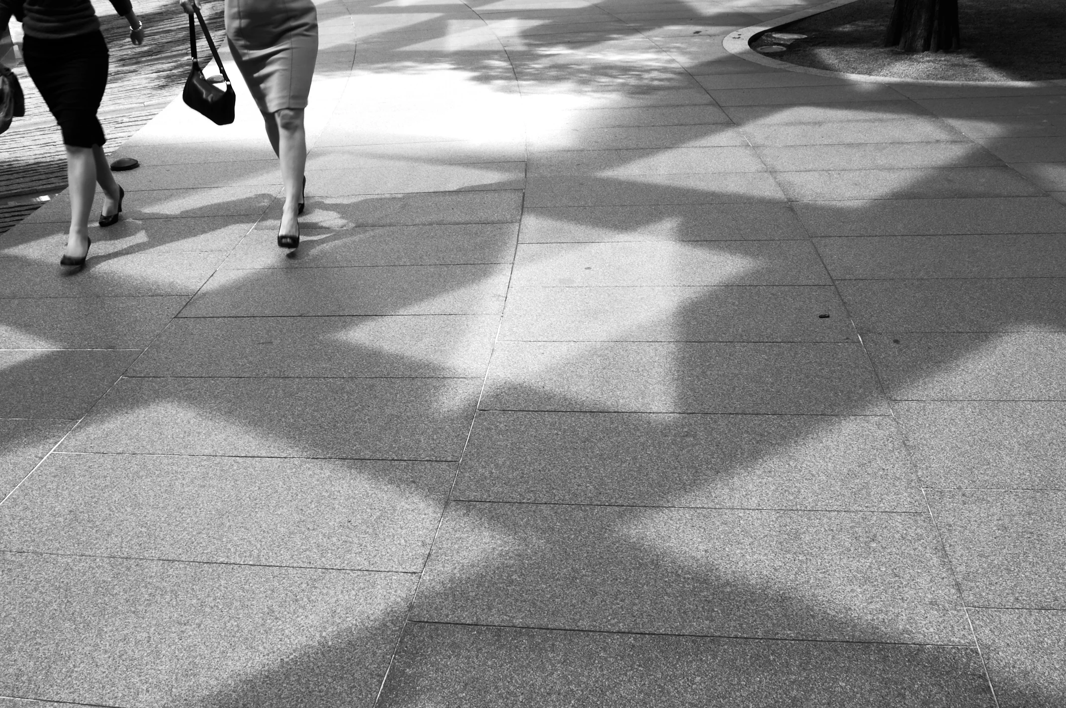 Women walking past the Gherkin, London