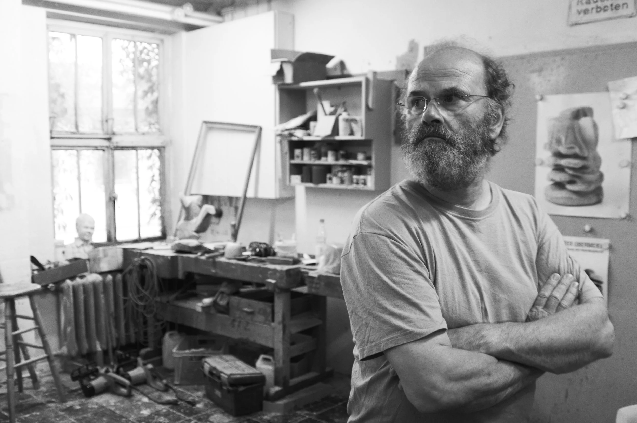 Black and white portrait of artist Peter Obermeier at his studio in Bremen, Germany