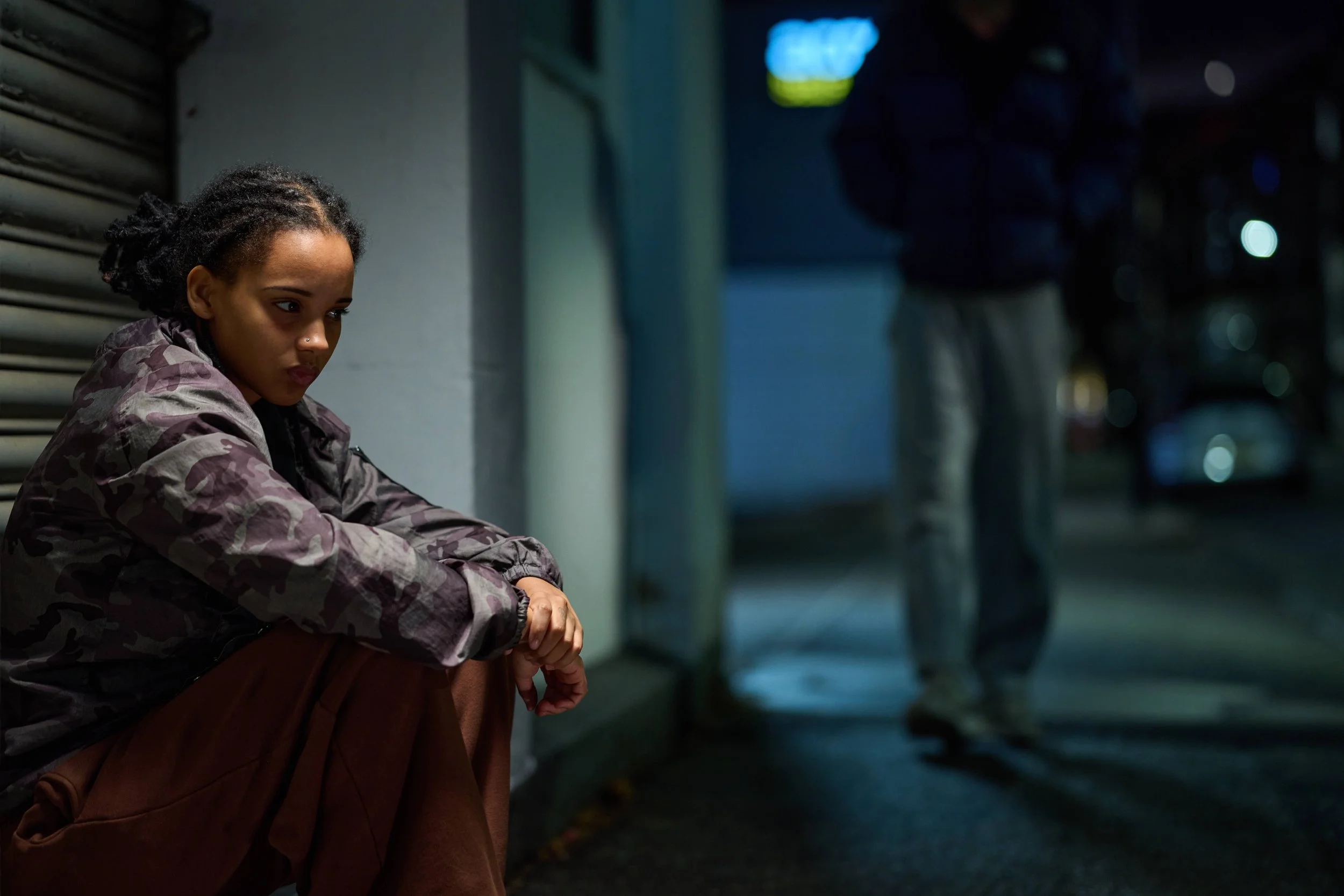 Portrait of a young woman at night