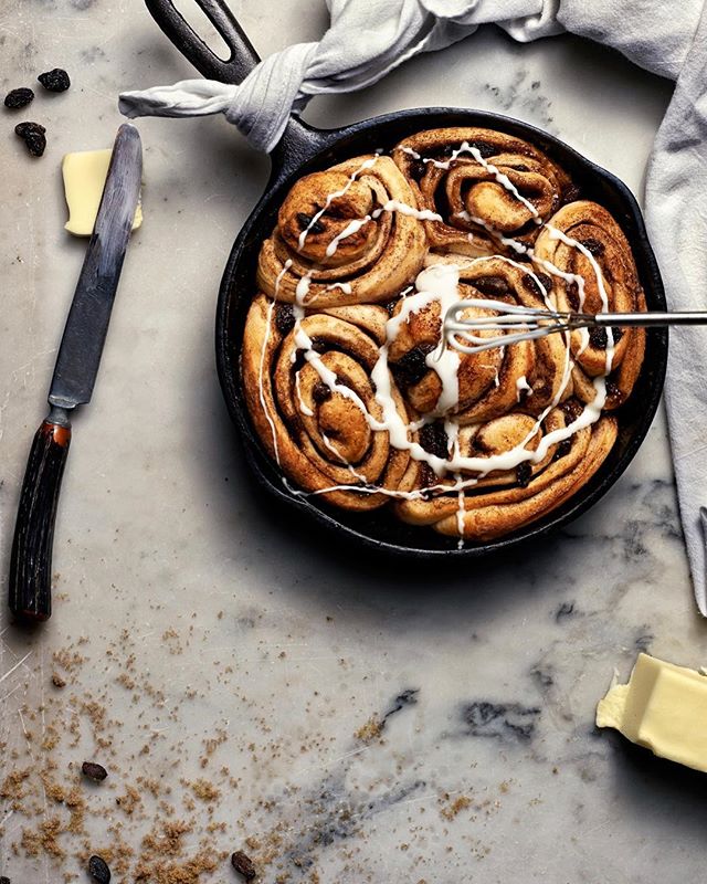 This picture reminds me of making cinnamon rolls with my mom. Watching her slather melted butter onto long sheets of dough and sprinkling with generous handfuls of brown sugar and cinnamon before effortlessly rolling into perfect rolls. 
Call your mo