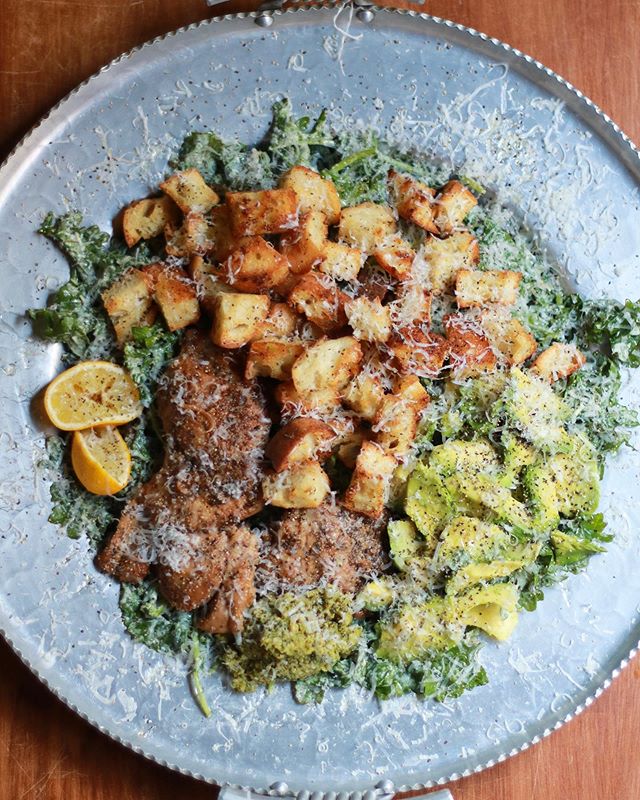 Did you know the Caesar salad was invented in Tijuana, Mexico in 1924? 
When it&rsquo;s 80 something degrees outside all I want for dinner is salad: 
kale Caesar with lemon pepper chicken thighs, a dollop of olive tapenade, a small mountain of garlic