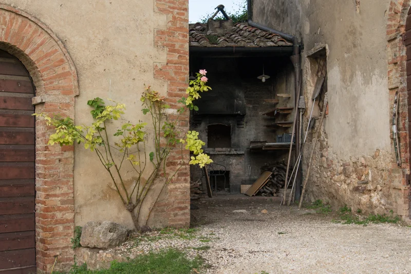 The pizza oven is in the back