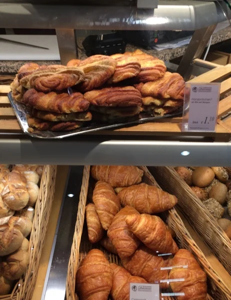 normal croissants on bottom, 2D croissant-like Leckere Franzbrötchen on top