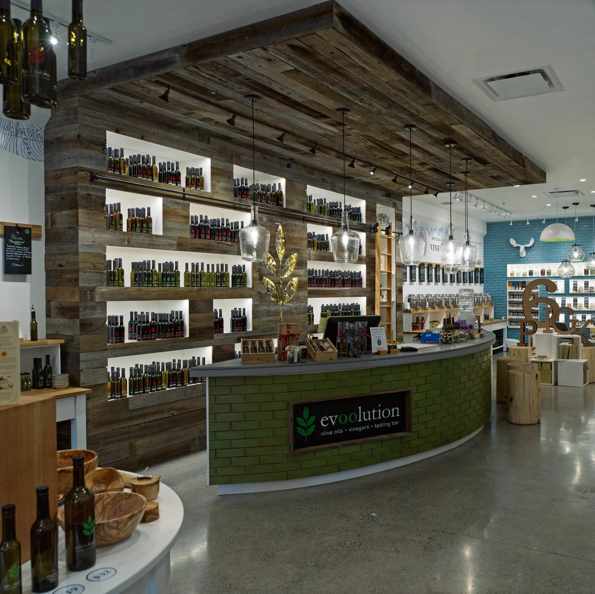Evoolution Canmore: This 1,400ft2 new olive oil and vinegar retail store and tasting bar was designed by Kaben Design. This store incorporated high end, reclaimed and sustainable finishes to deliver and absolutely stunning and busy store to Main St. in Canmore, AB. ACS was involved from day one to help conceive the budget and schedule, ensure it was in line with the owners expectations and ultimately deliver on time and on budget. 
