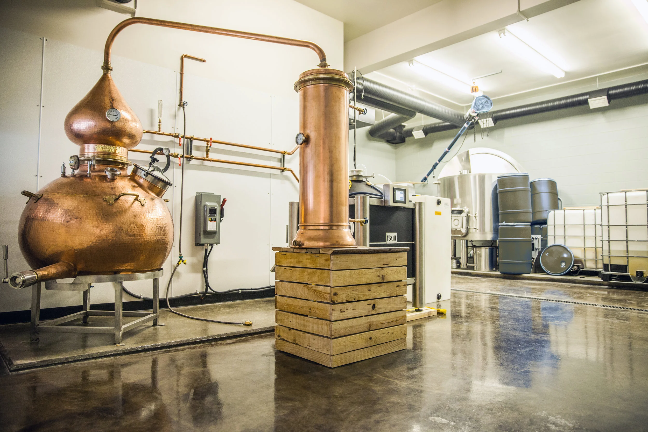 WildLife Distillery: This 1400ft2 design-build of Canmore's first micro distillery consisted of creating a tasting and retail area and distillery complete with an engineered raised concrete production floor, new HVAC and ventilation equipment, electrical and fire alarm systems as well as an all new complex mechanical system as required for the owner's selected gin, vodka and whiskey distilling equipment. This project was done in collaboration with Nest Design and Drafting Studio from Canmore. 