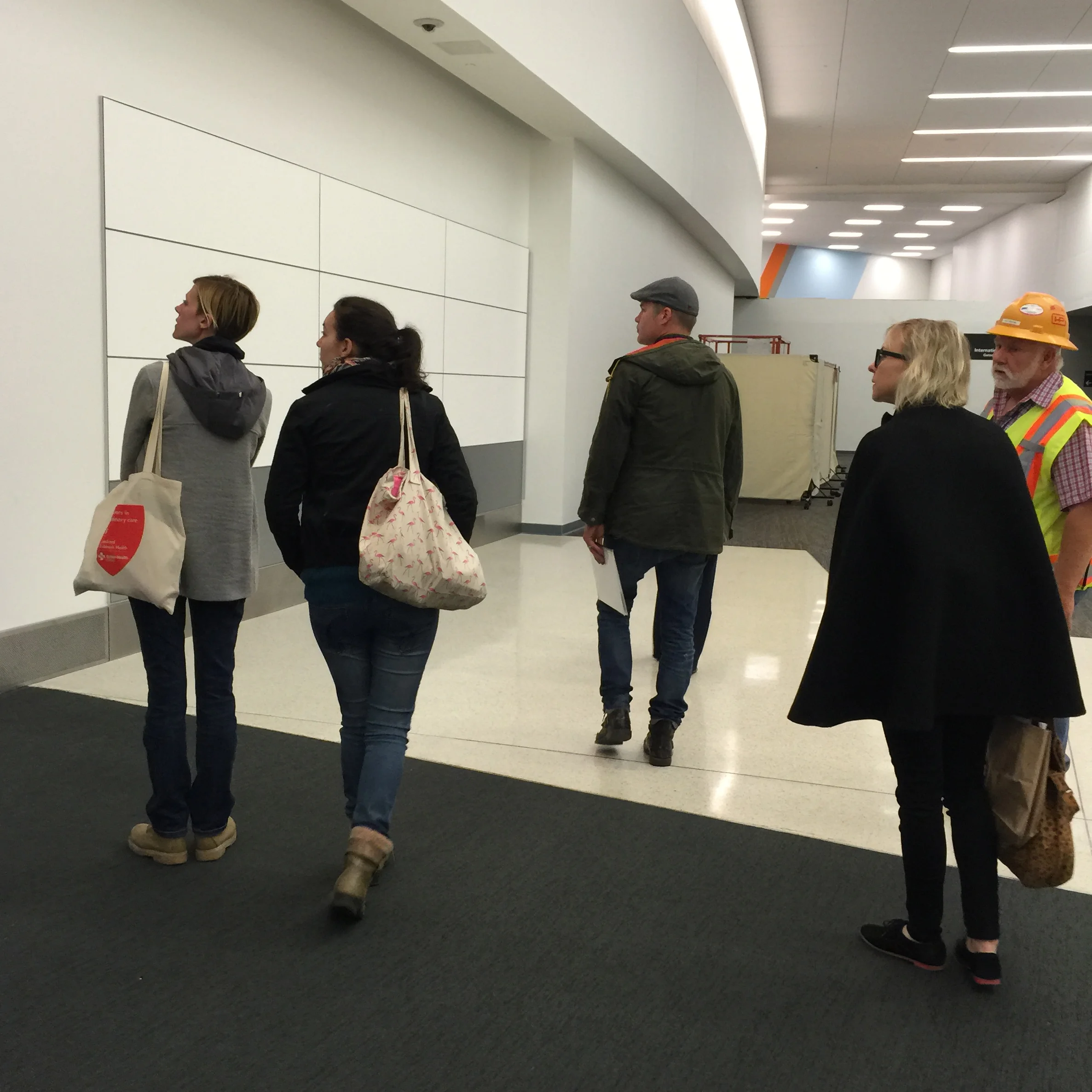 The team surveys the area in Terminal 3 where we will install the mural.