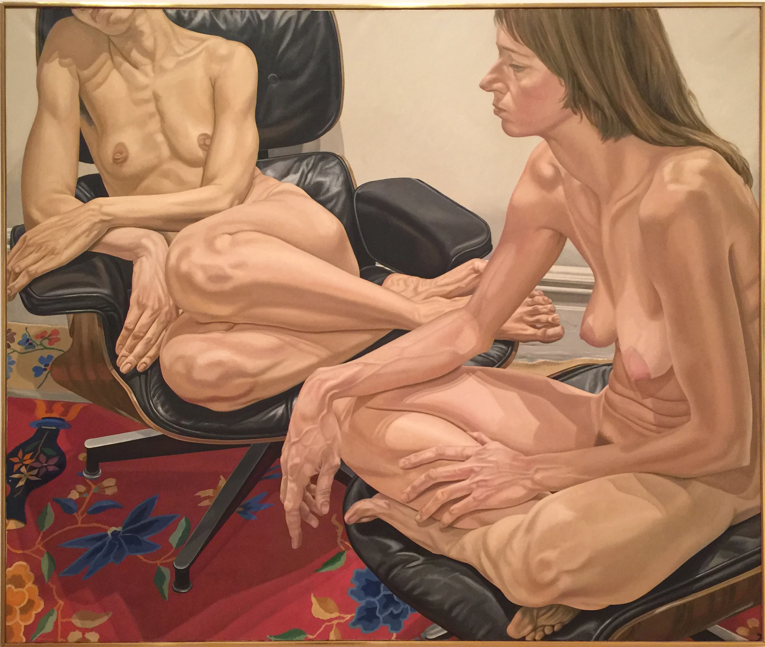 One of the best Pearlsteins I have ever seen: Two Female Models on Eames Chair and Stool, 1976. The use of color, diagonal figure- eight composition, strong vectors and repetition of linear elements (fingers, stomach, breastbone) make for a very dynamic picture. 