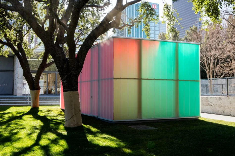 Somehow, the colored films shift and mix, producing a soft and playful cubic form. 