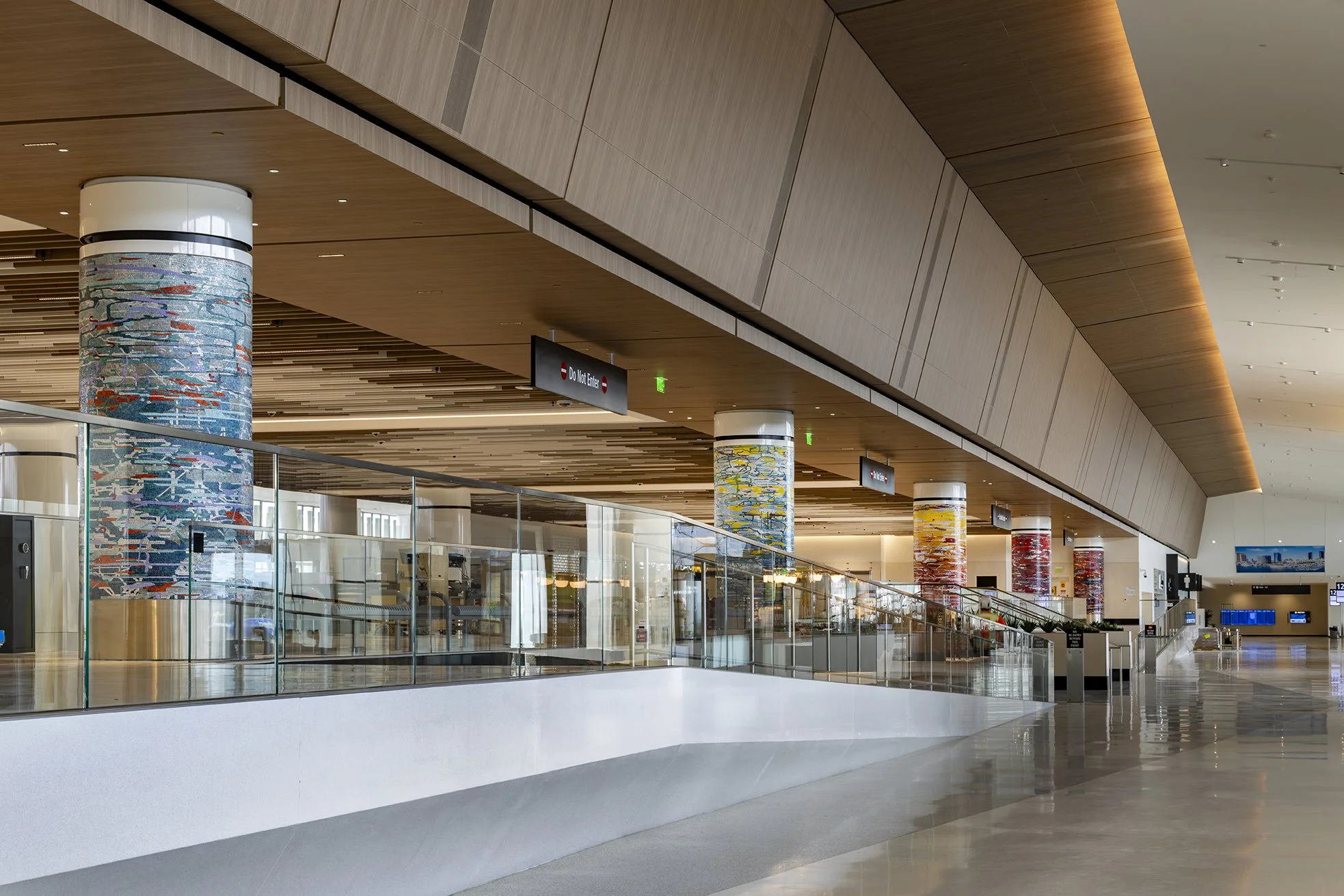 A Day in the Sun , 2025 Glass mosaic on six columns, terrazzo floor Each 54 inches in diameter, 120 inches high New Terminal 1 San Diego International Airport