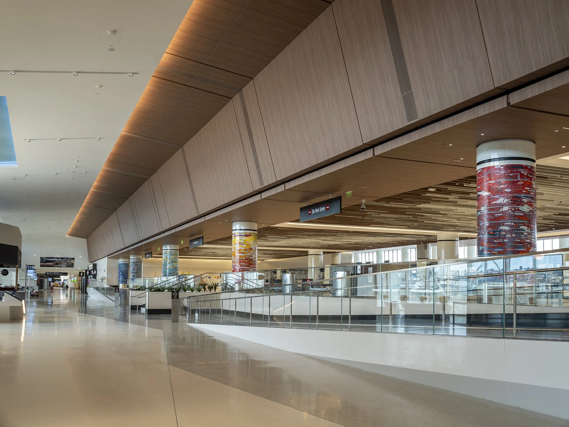 A Day in the Sun , 2025 Glass mosaic on six columns, terrazzo floor Each 54 inches in diameter, 120 inches high New Terminal 1 San Diego International Airport