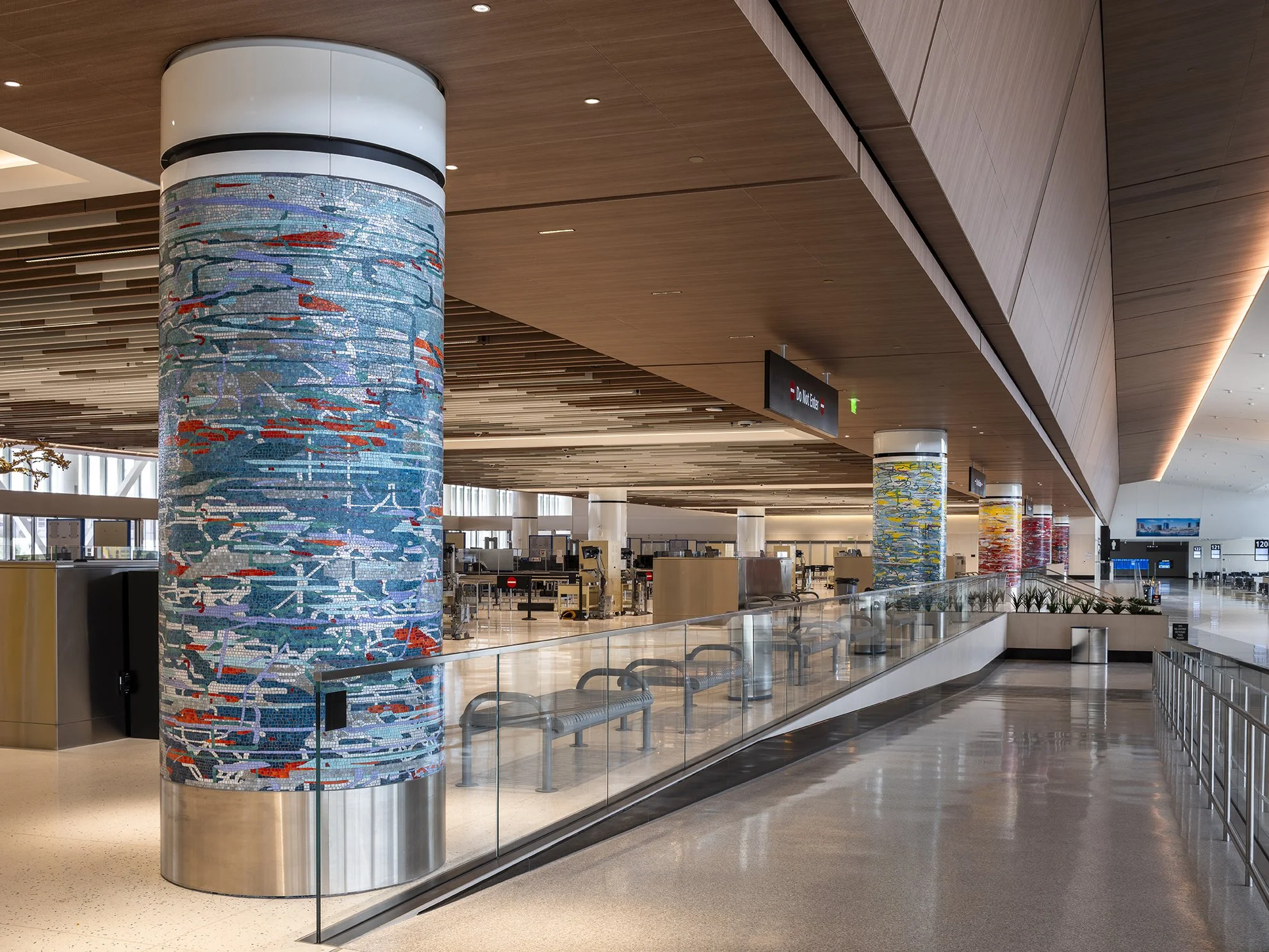 A Day in the Sun , 2025 Glass mosaic on six columns, terrazzo floor Each 54 inches in diameter, 120 inches high New Terminal 1 San Diego International Airport