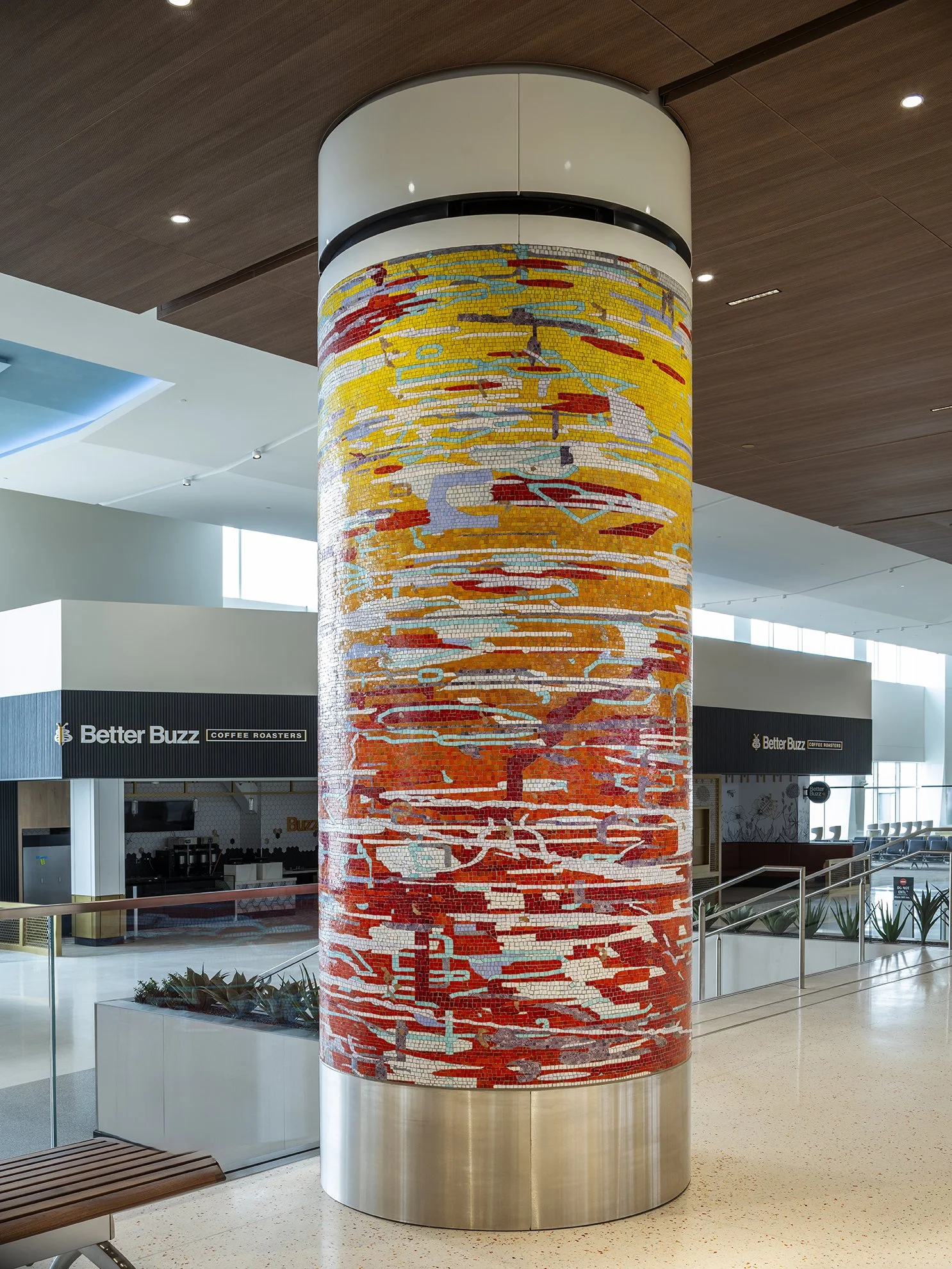A Day in the Sun , 2025 Glass mosaic on six columns, terrazzo floor Each 54 inches in diameter, 120 inches high New Terminal 1 San Diego International Airport