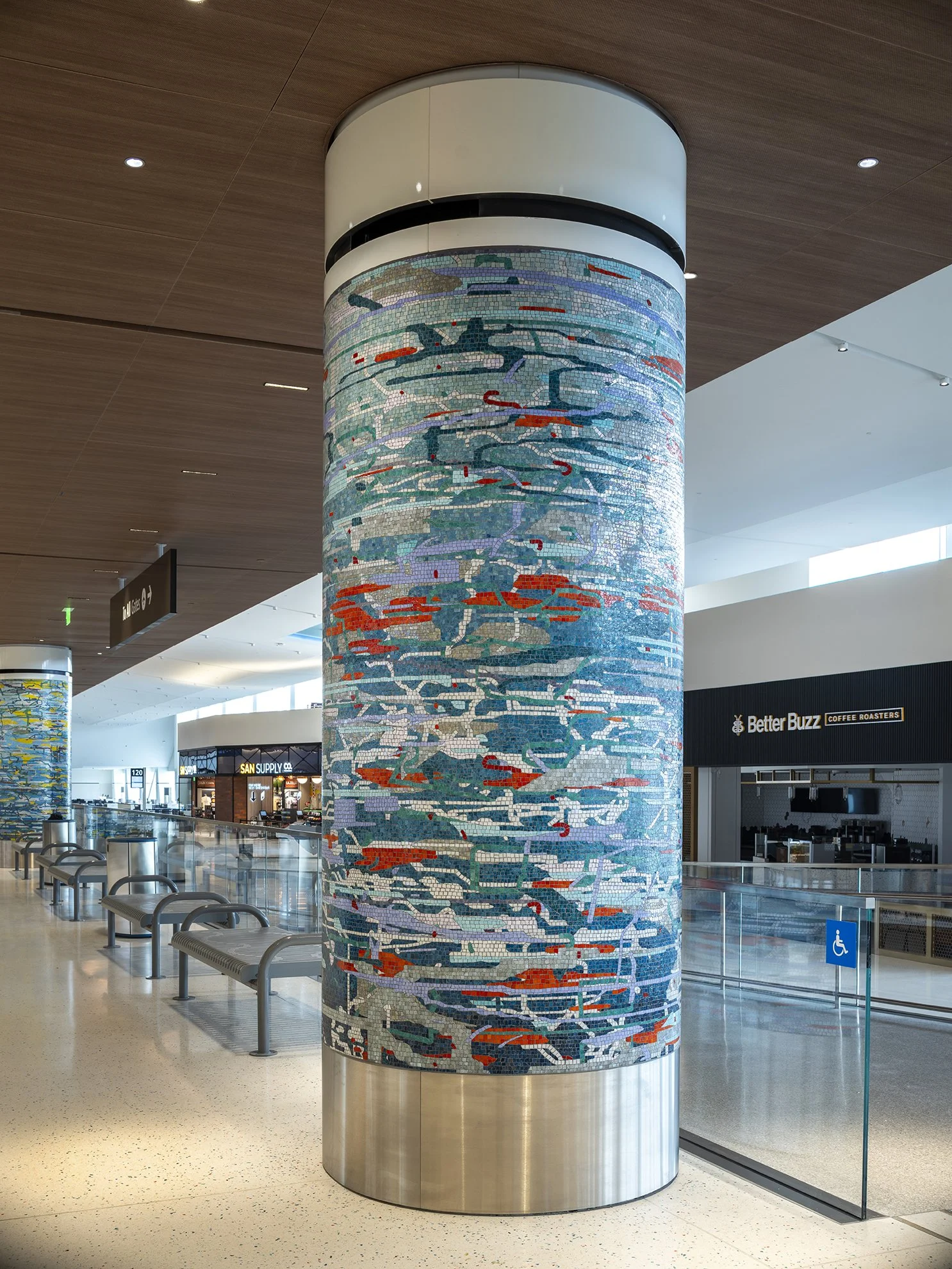 A Day in the Sun , 2025 Glass mosaic on six columns, terrazzo floor Each 54 inches in diameter, 120 inches high New Terminal 1 San Diego International Airport