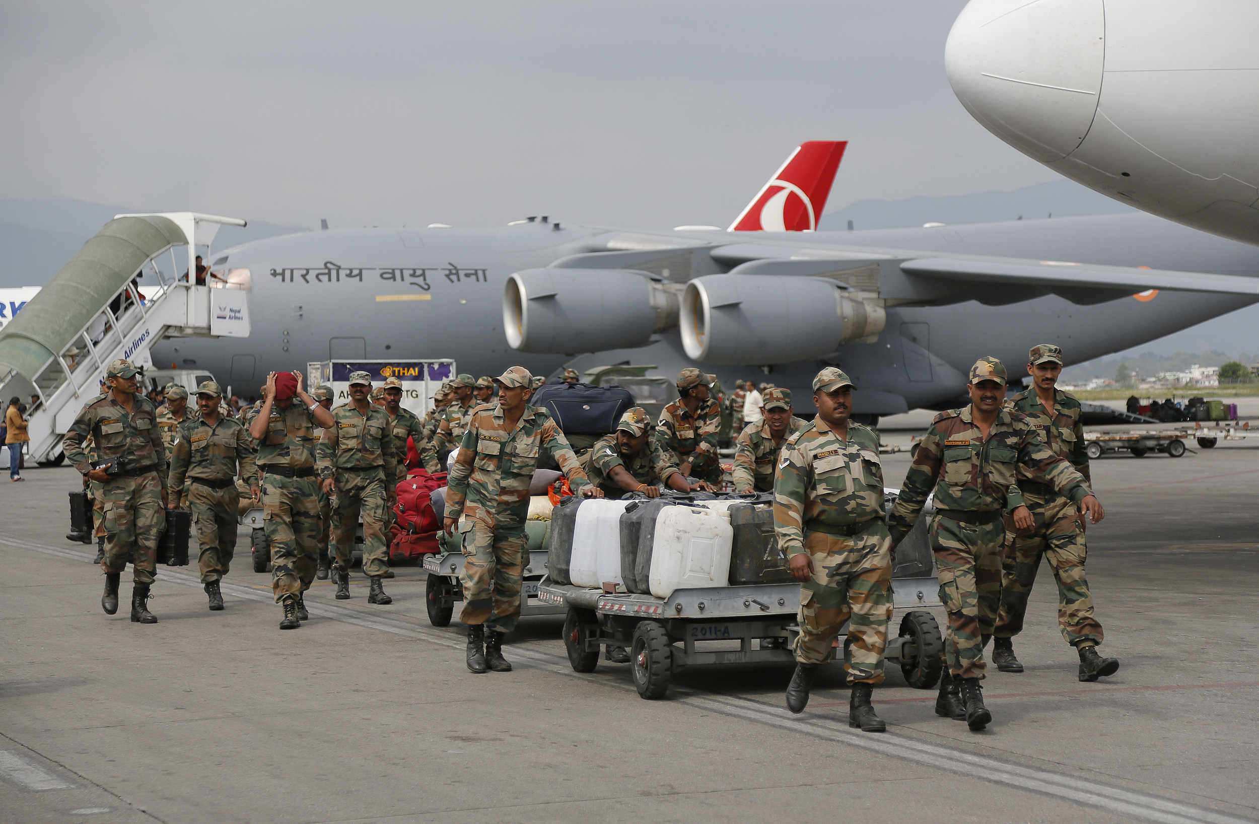Indian soldiers arrive with supplies at the Tribhuwan International Airport on April 26.&nbsp;(Photo: Wally Santana, AP)