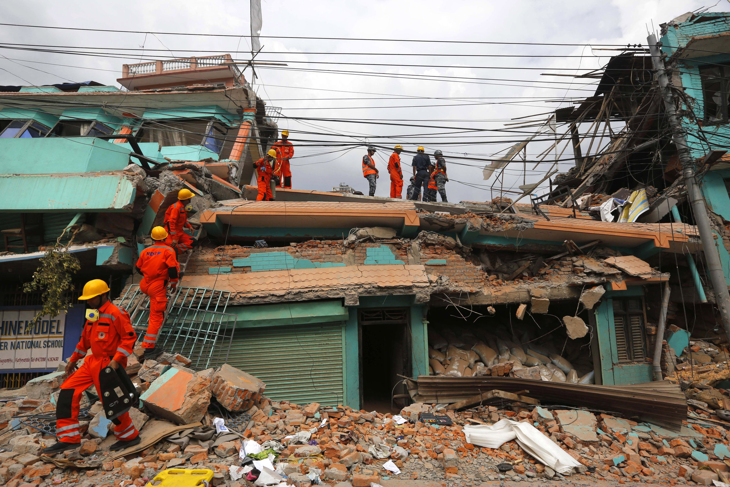 India's National Disaster Response Force personnel look for survivors in a building in Kathmandu on April 26.&nbsp;(Photo: Manish Swarup, AP)