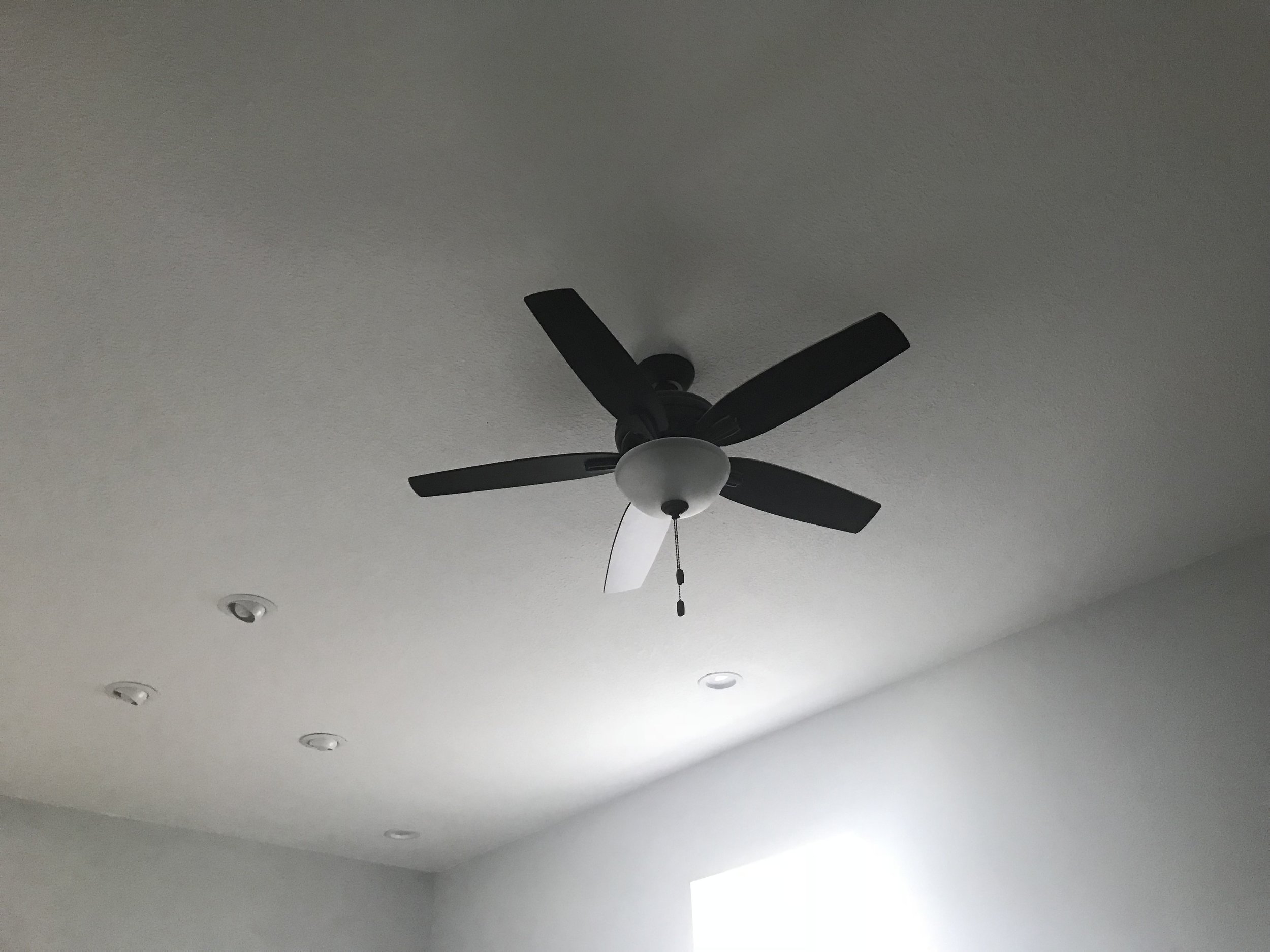 Ceiling fan and recessed lights in living room