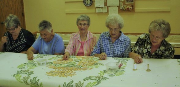  Our Wednesday Quilters  working on a quilt for our raffle. 