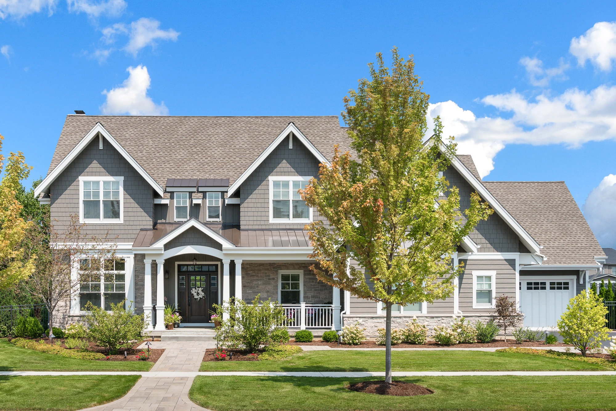 Geneva, Illinois Family Home with Outside Oasis A warm front porch welcomes you into this two story, transitional-style home. The rich, dark hardwood floors flow from the large foyer to to the open concept kitchen, dining, and living room area complete with coffered ceiling. An L-shaped mudroom has floor to ceiling storage for coats, shoes, and backpacks while the adjacent desk keeps the family organized. A full basement with an oversized island is the ideal place for entertaining during the Chicago winters while the backyard in ground pool is the perfect place to host gatherings in the warmer months!