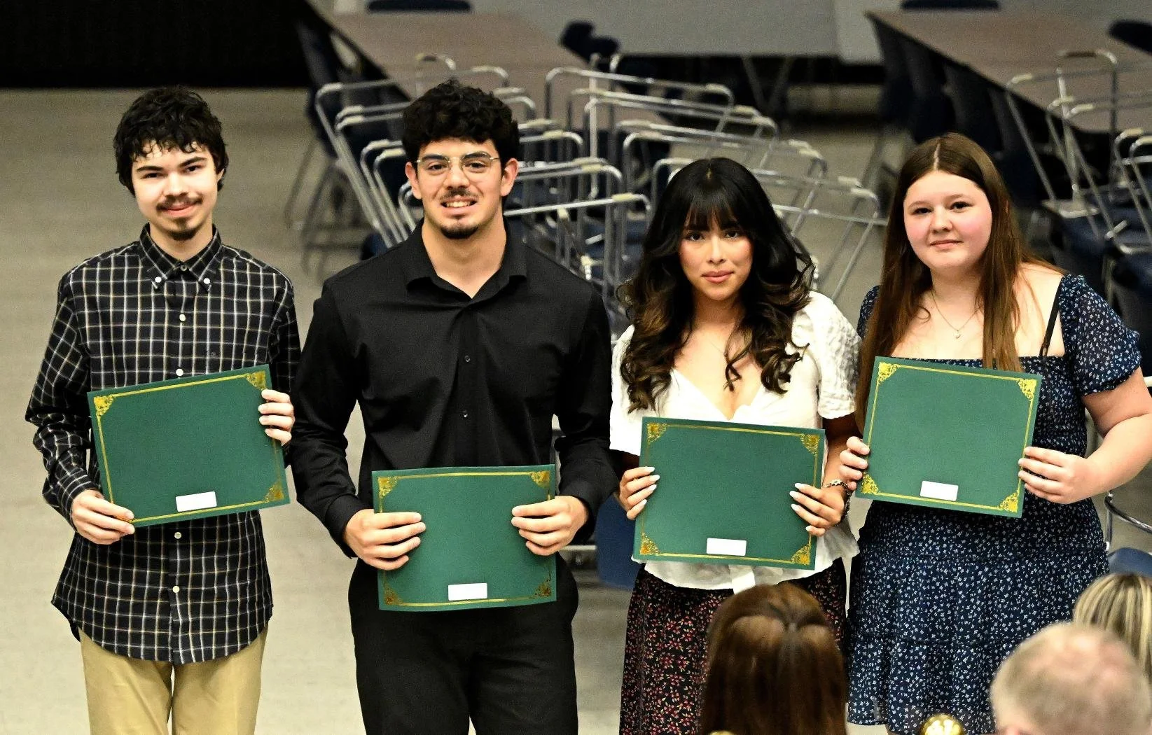 Four Cole Scholarship recipients from West Noble High School receive their Questa award certificates.