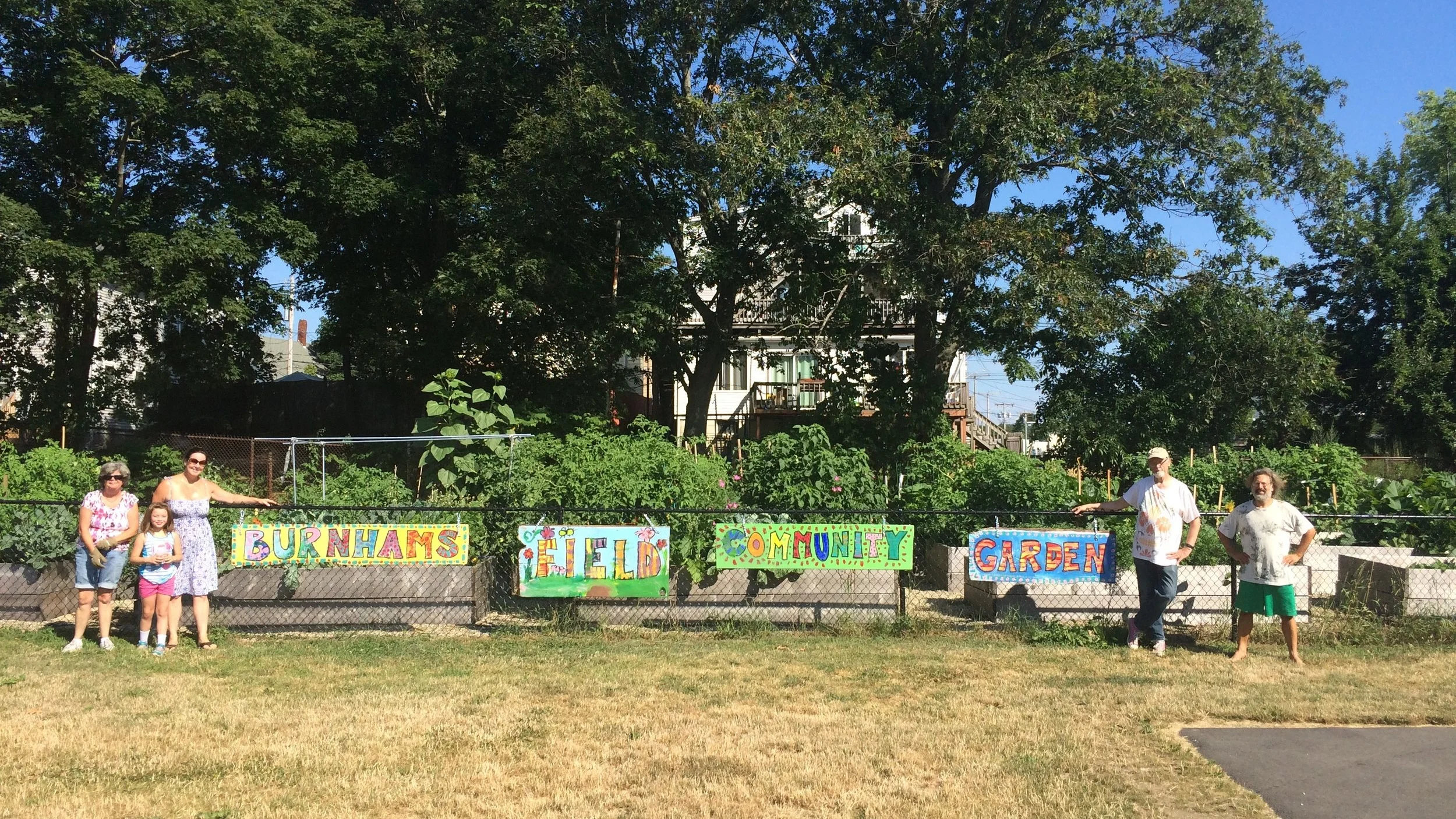 Community gardeners unveil the Burnham’s Field Community Garden sign
