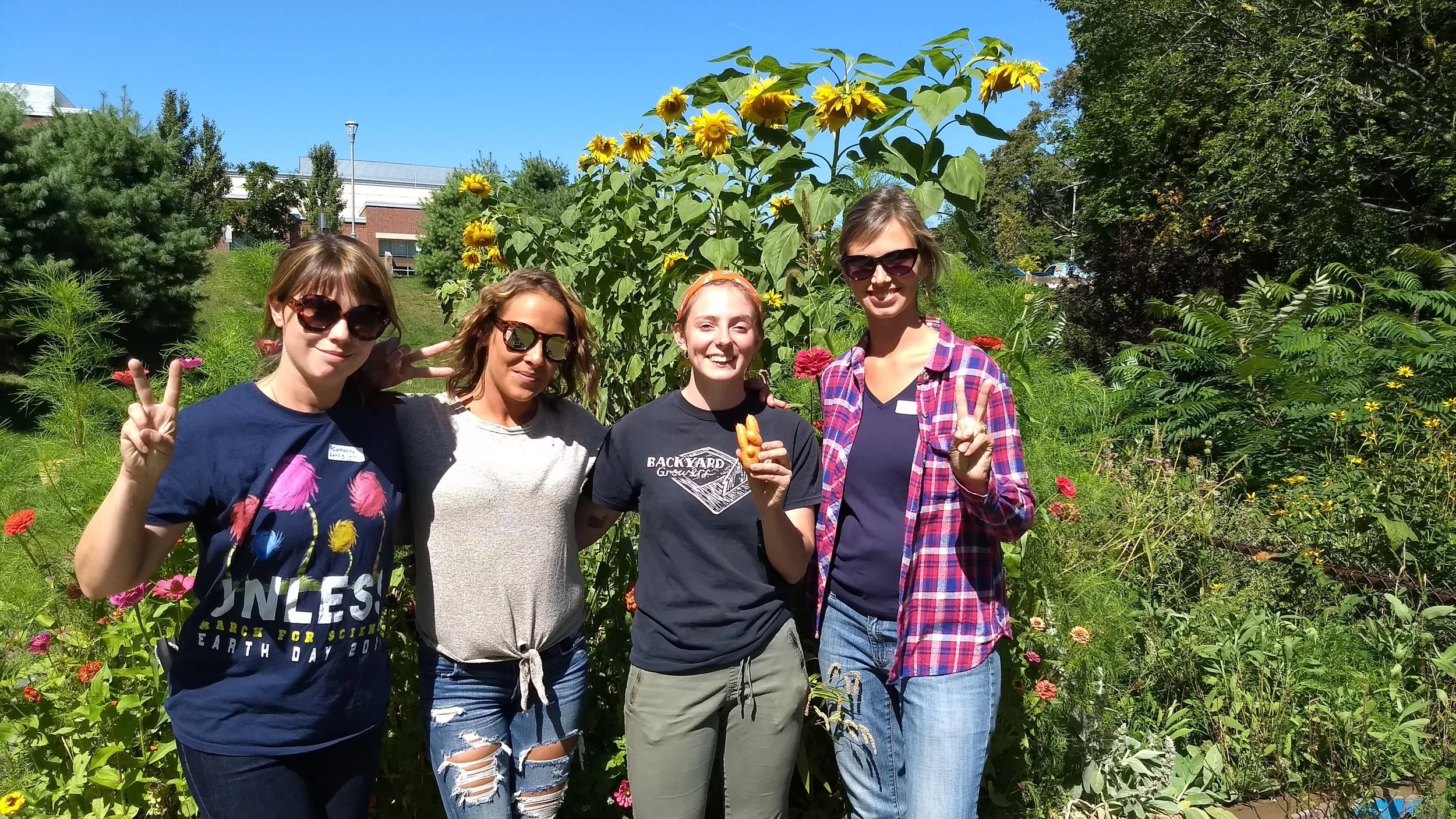 Emily Brown with parent volunteers during BYG’s Fall Harvest Days