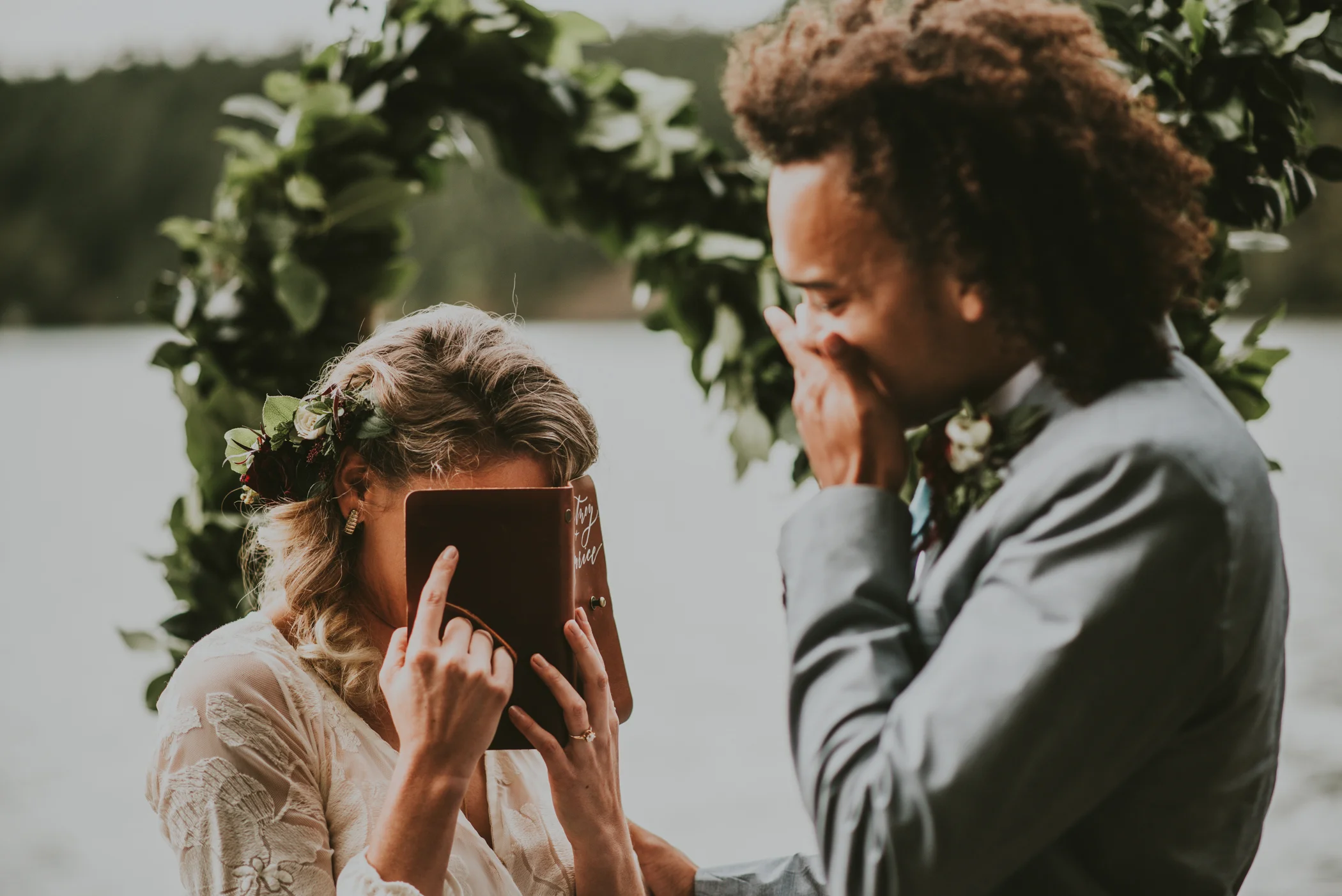 Bride crying during personal vows at her lake side elopement photographed by Big Sur Wedding photographers Tessa Tadlock  