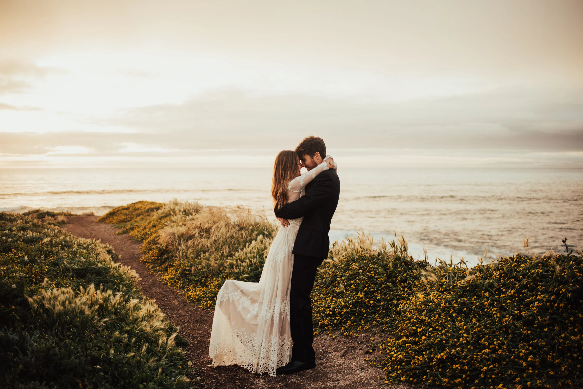 Oceanside couple portraits with boho bride &amp; groom Photographed by Big Sur Wedding Photographers Tessa Tadlock 