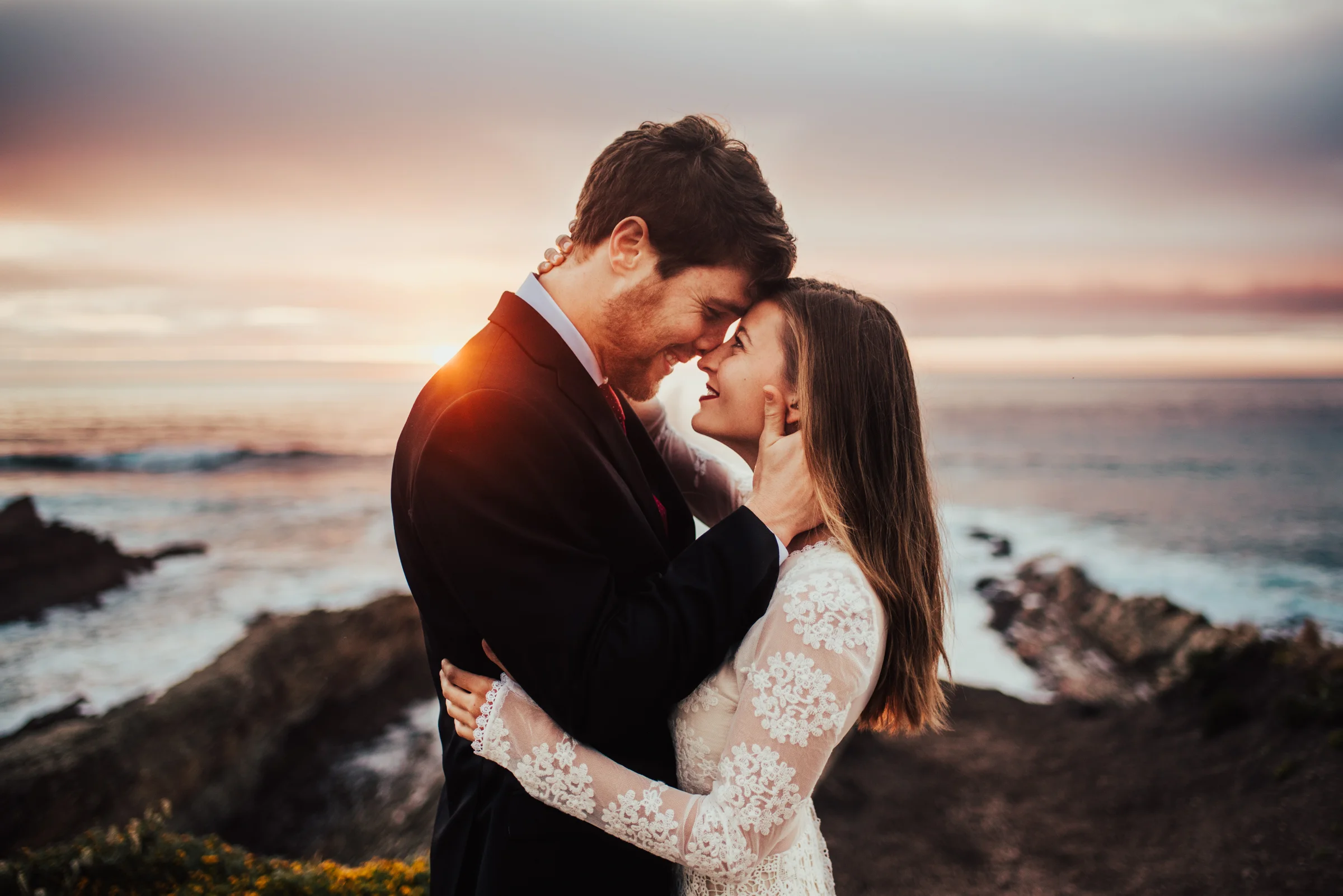 Bride &amp; Groom touch foreheads during sunset portrait session photographed by Big Sur Wedding Photographers Tessa Tadlock 
