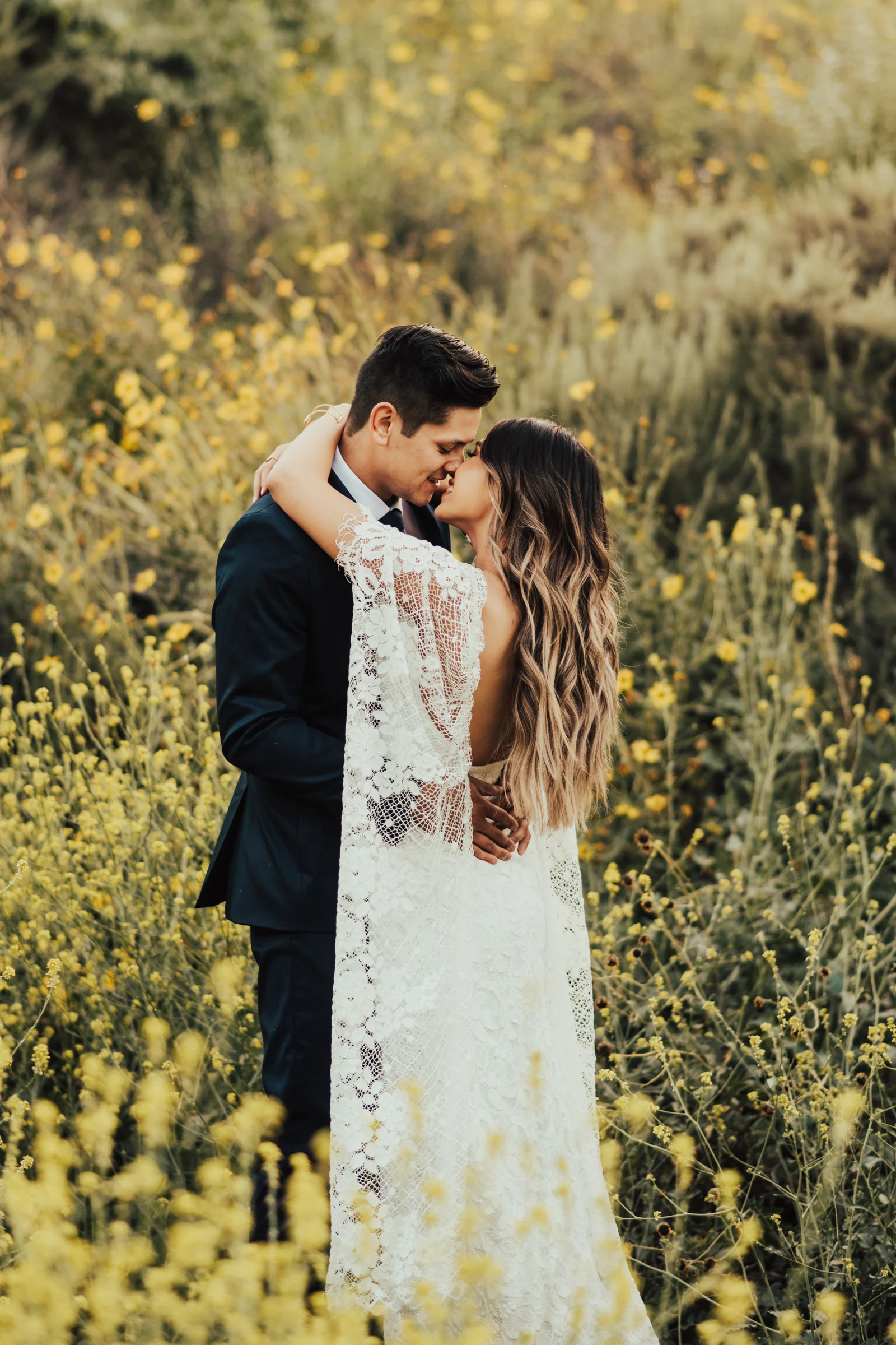 Boho Bride &amp; Groom Portrait in a Field of Yellow Wildflowers Photographed by Big Sur Wedding Photographers Tessa Tadlock