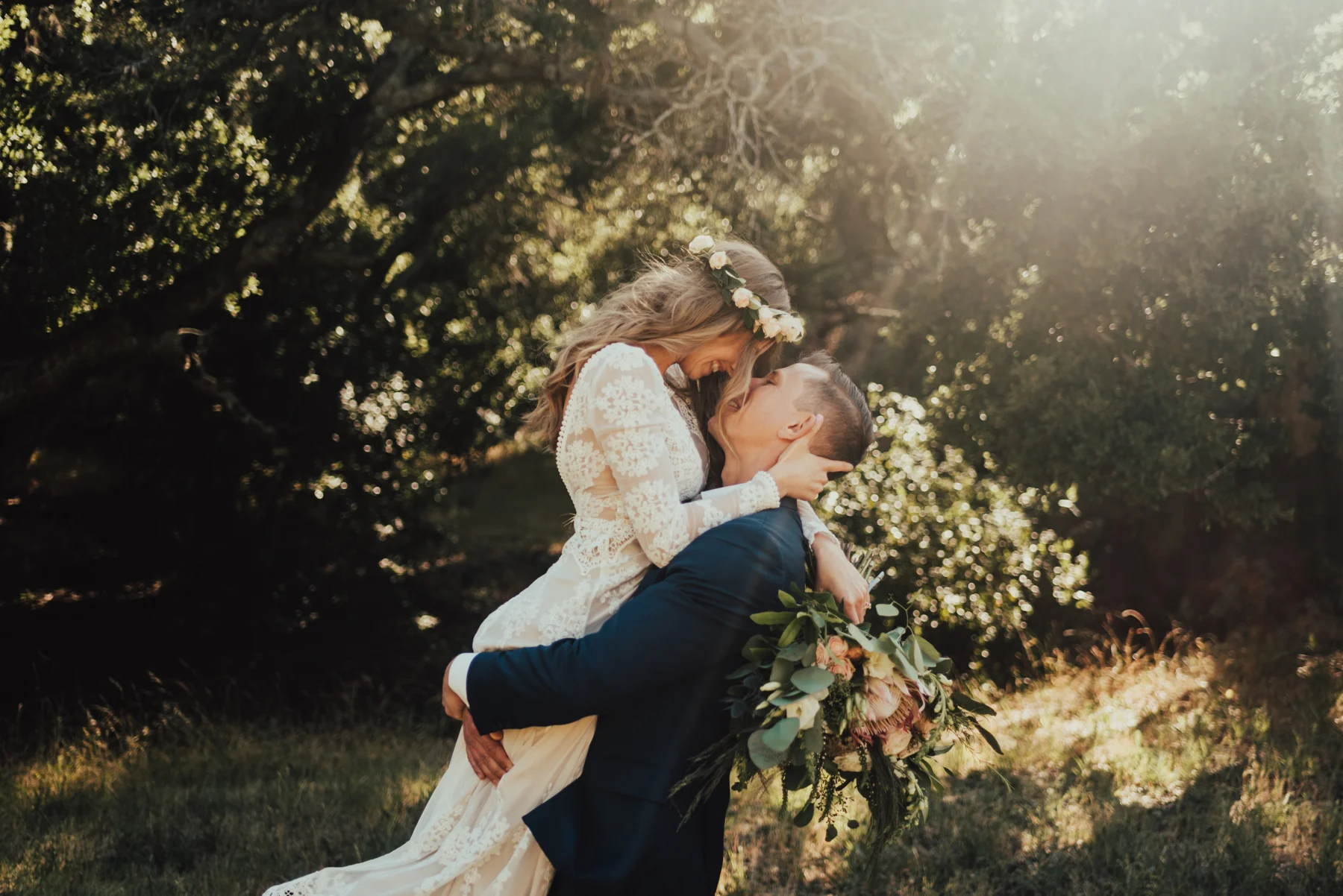 Sweet Groom Lifts his Boho Bride Photographed by Big Sur Wedding Photographers Tessa Tadlock