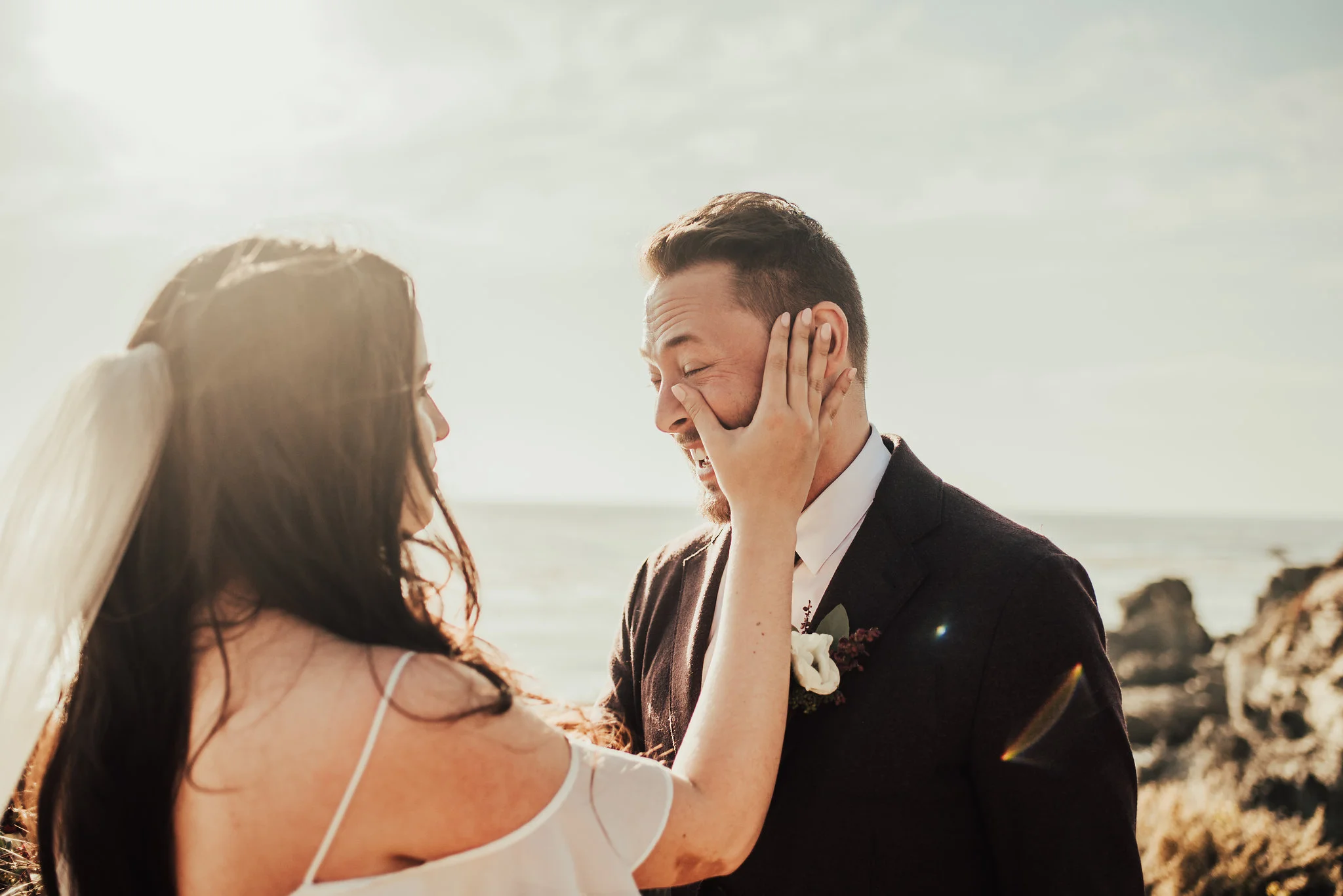 Bride Wipes Away Groom's Tears during Big Sur Elopement Photographed by Big Sur Wedding Photographers Tessa Tadlock 