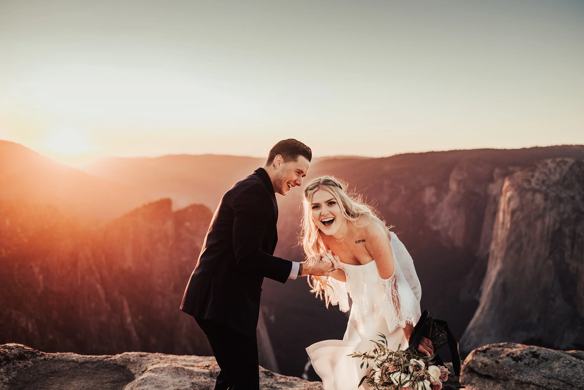 Bride &amp; groom laugh during sunset Yosemite elopement portraits photographed by Big Sur Wedding Photographers Tessa Tadlock 