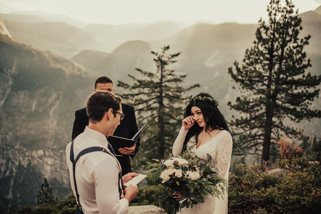 Bride Wipes Away Tears during Emotional Yosemite Elopement Photographed by Big Sur Wedding Photographers Tessa Tadlock