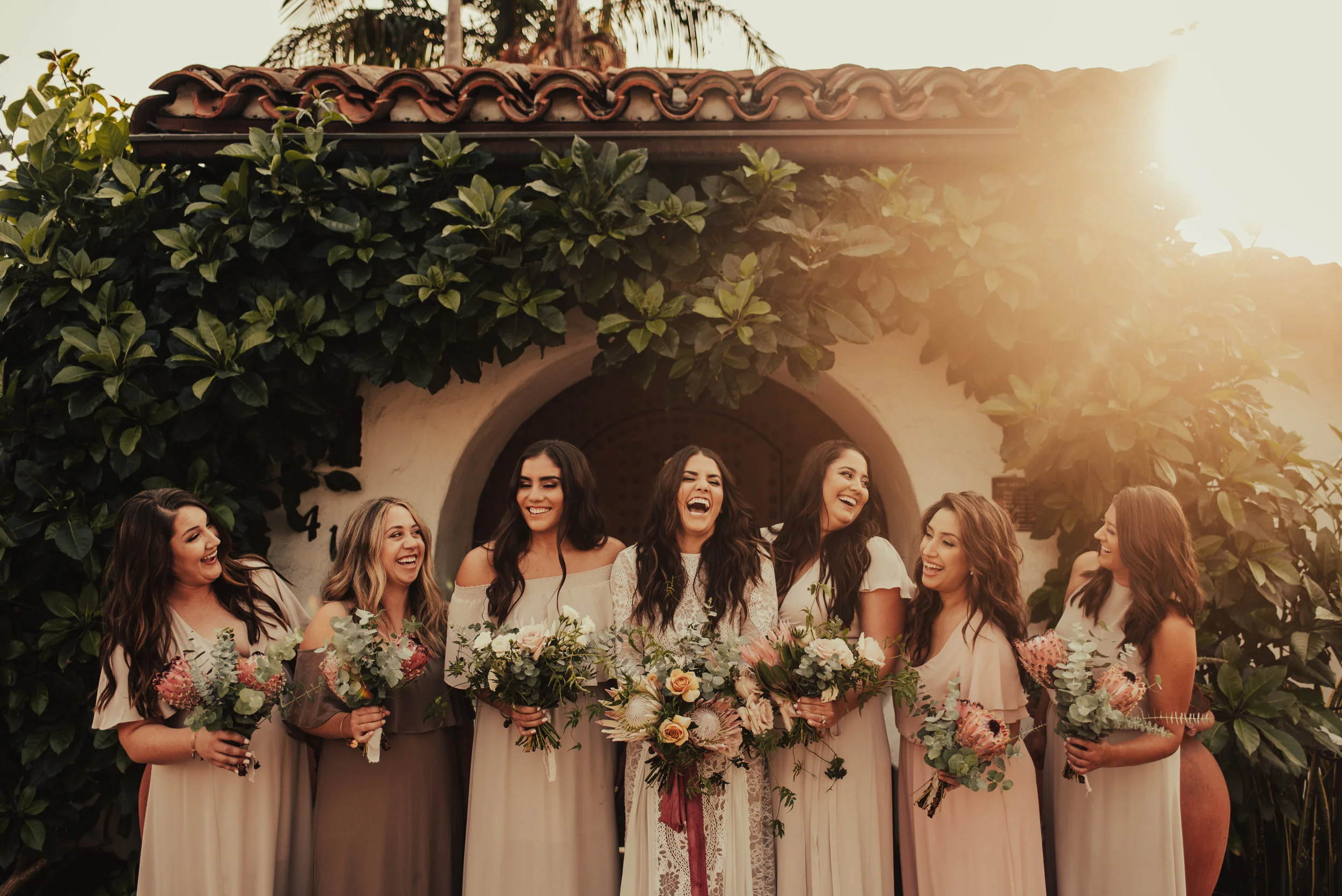 Bridal party wears neutral blush tones with boho florals photographed by Big Sur Wedding Photographers Tessa Tadlock 