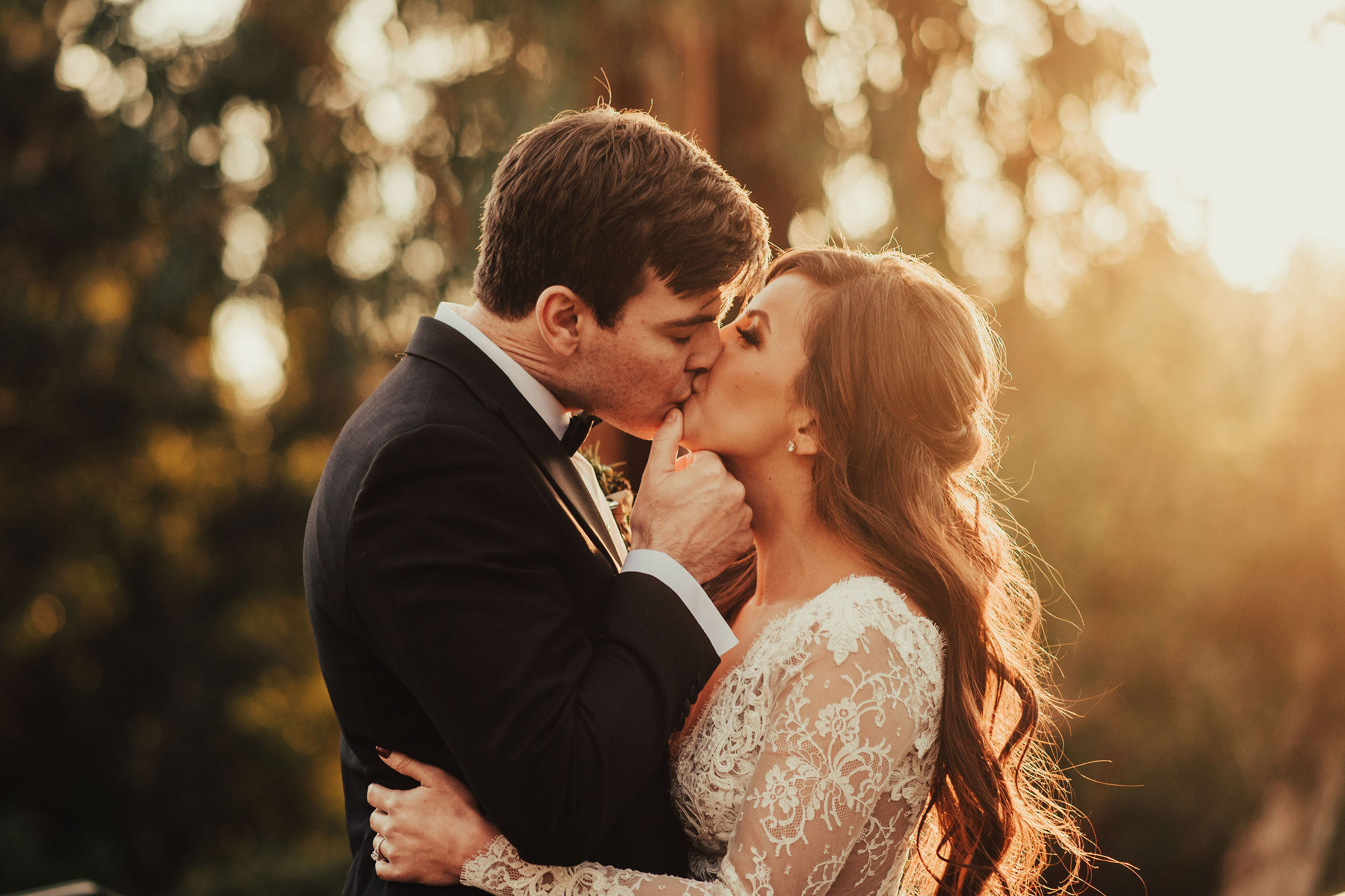 Romantic Bride & Groom Kissing at Sunset Photographed by Santa Barbara Wedding Photographers Tessa Tadlock