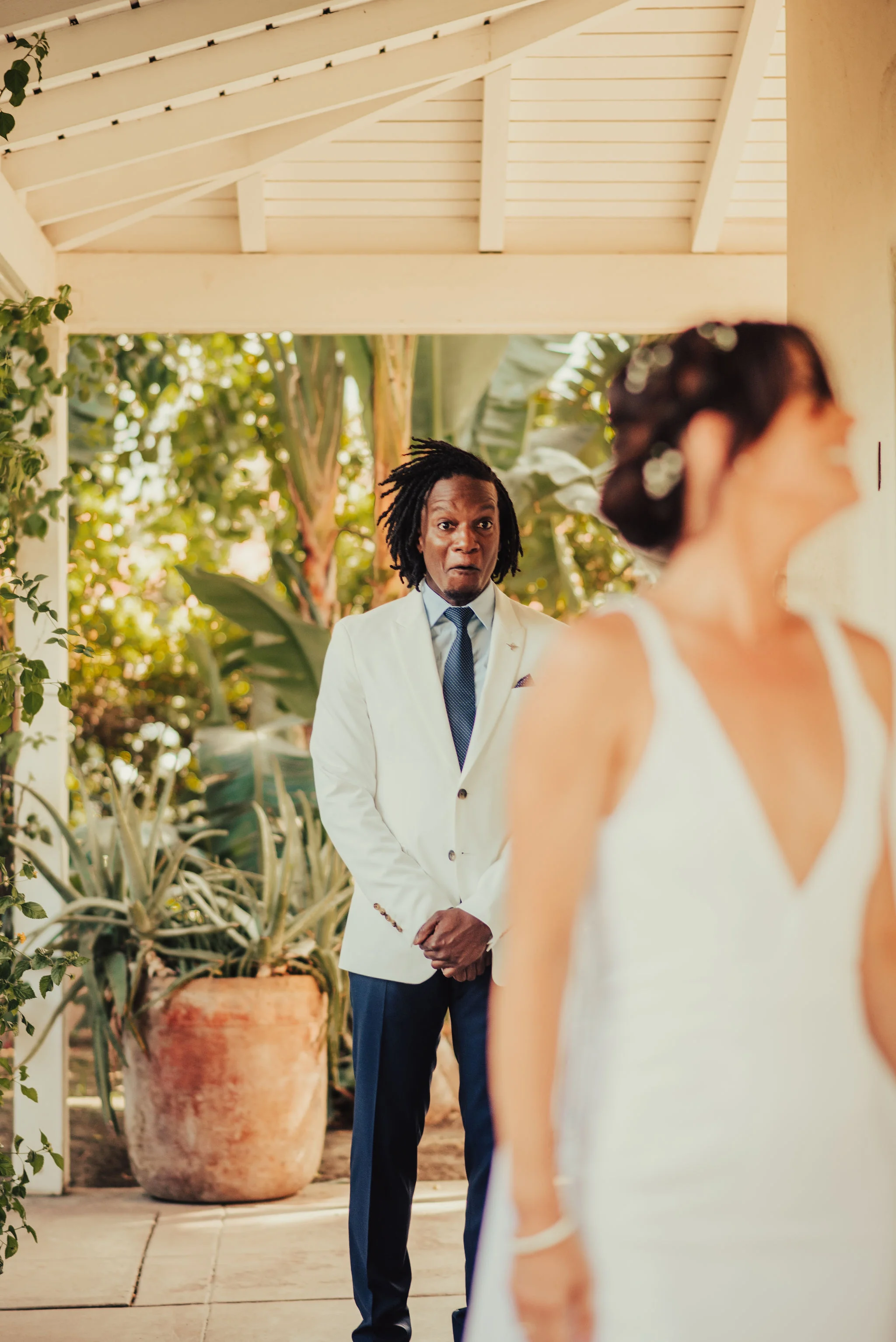 Best first look reaction of groom seeing his bride photographed by Big Sur Wedding Photographers Tessa Tadlock 