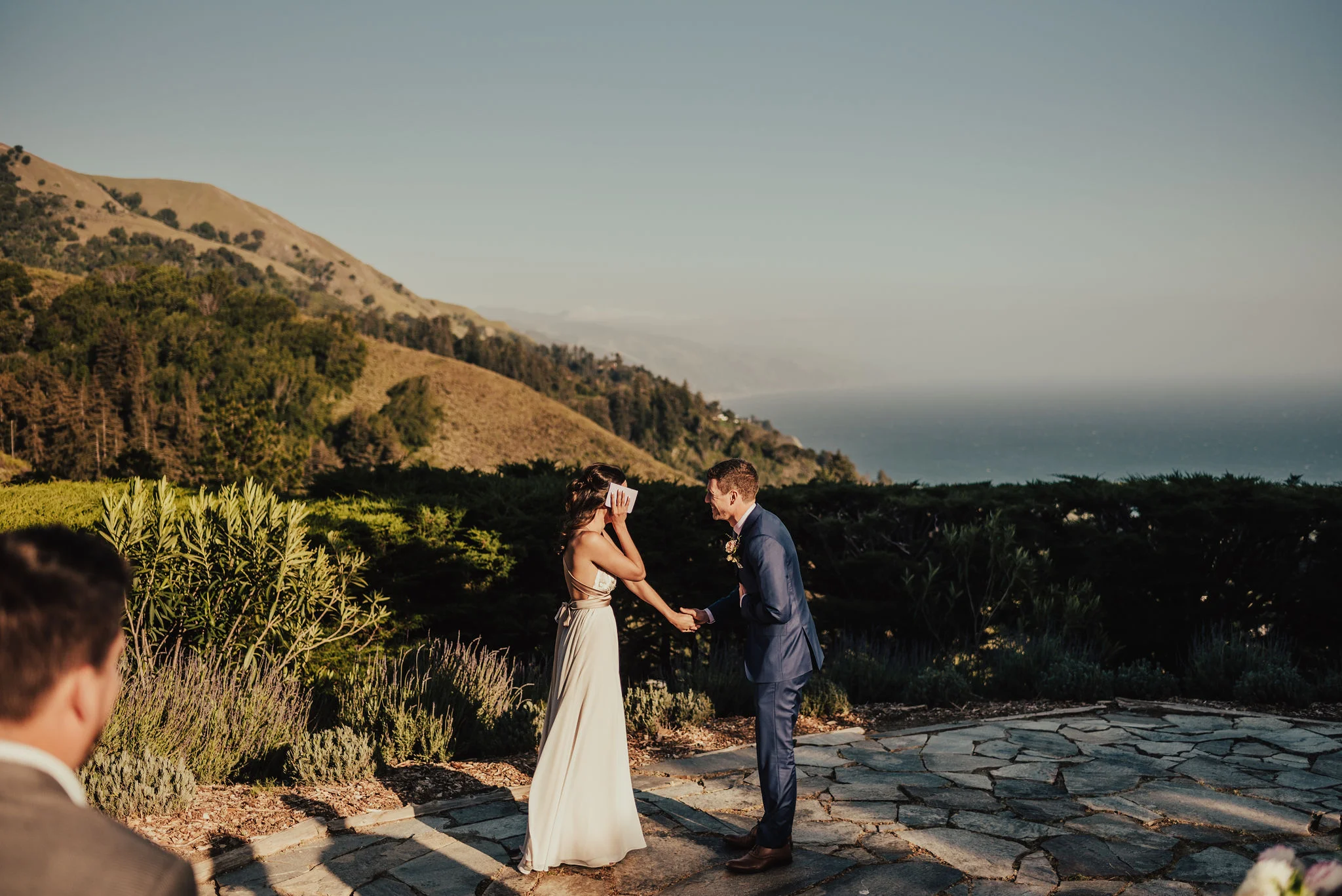 Groom reacts to bride's personal vows during Big Sur elopement photographed by Big Sur Wedding Photographers Tessa Tadlock 