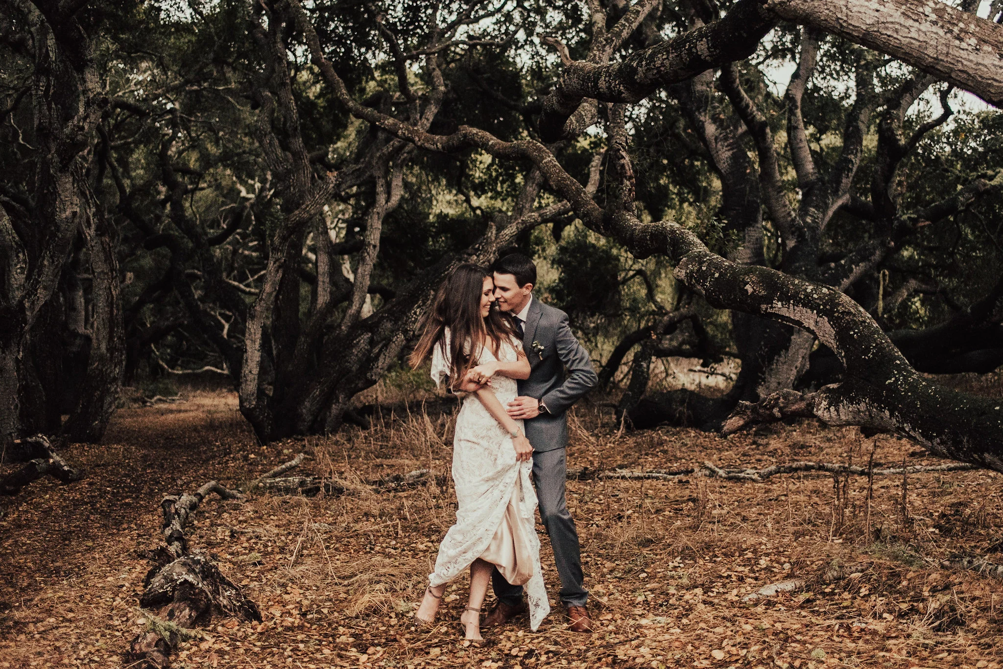 Sweet Bride &amp; Groom's First Look in an Orchard Photographed by Big Sur Wedding Photographers Tessa Tadlock