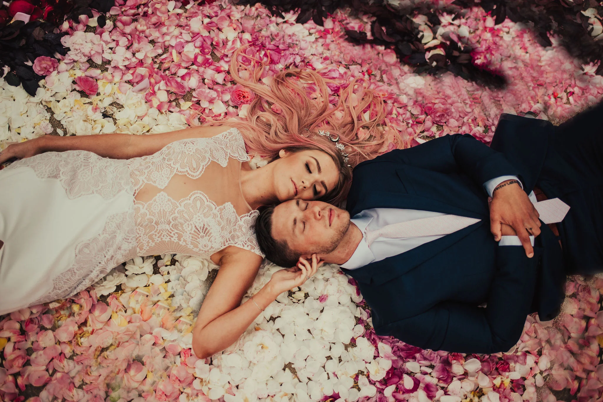 Boho Bride &amp; Groom Laying in Rose Petal Circle Photographed by Big Sur Wedding Photographers Tessa Tadlock