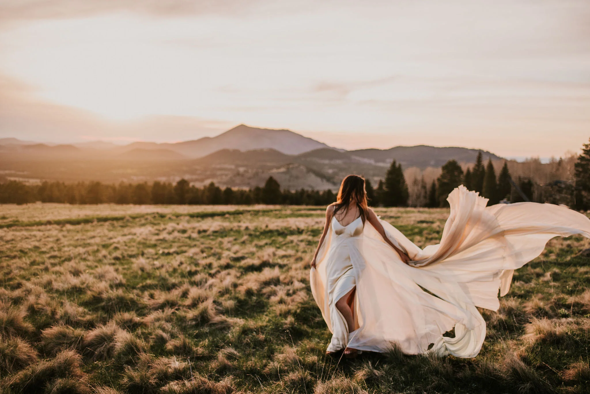 Boho Bride in Flowy Wedding Dress at Sunset Photographed by Big Sur Wedding Photographers Tessa Tadlock 