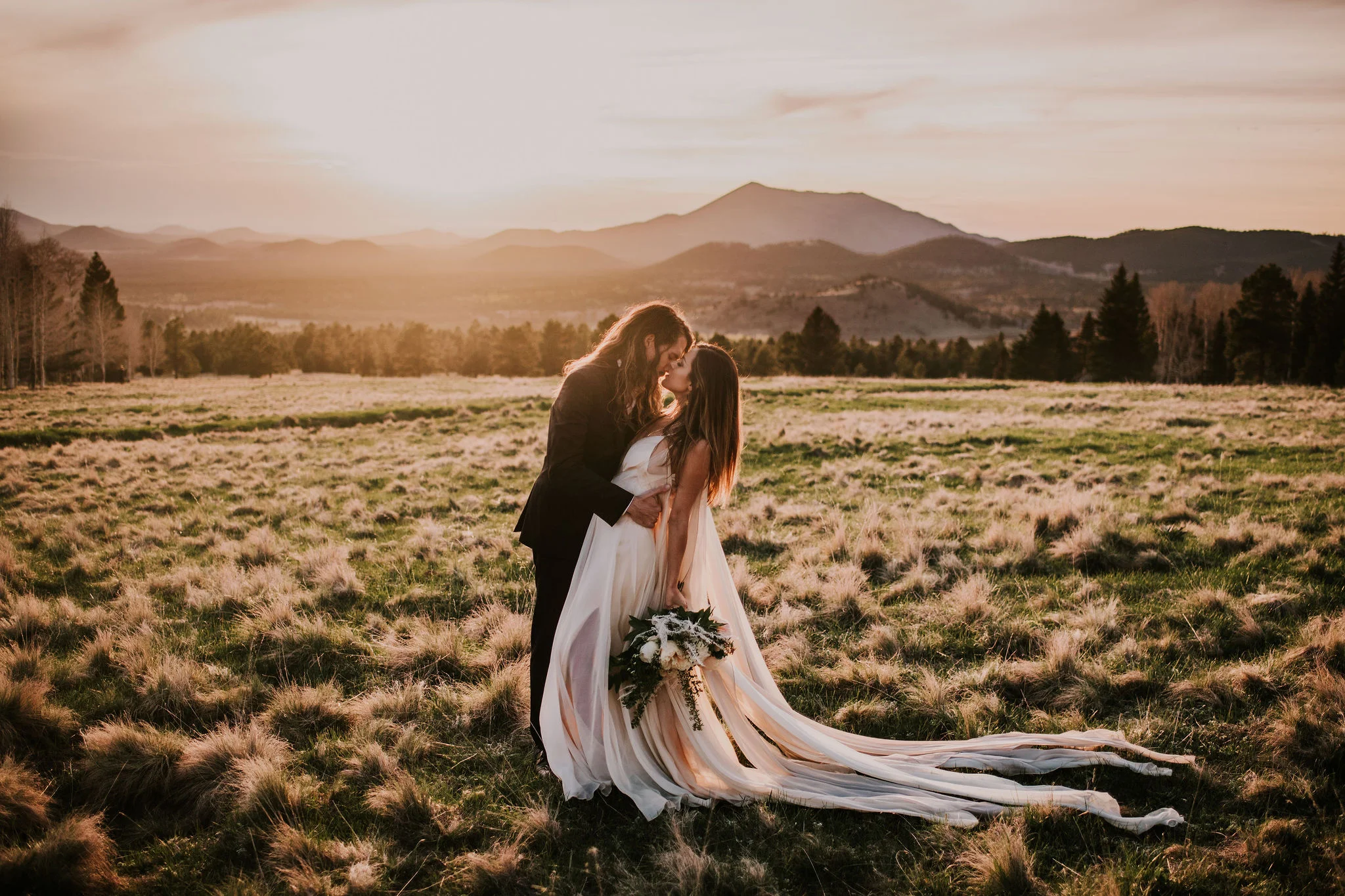 Mountainside Elopement Portraits in the Prettiest Field at Sunset Photographed by Big Sur Wedding Photographers Tessa Tadlock